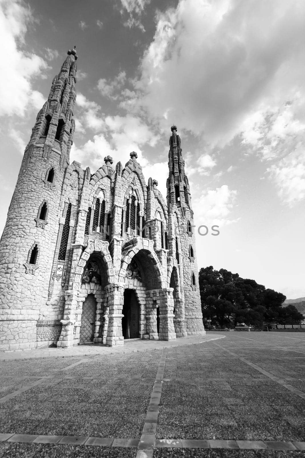 Novelda, Alicante, Spain- September 24, 2021: Details, archs, tower and pictures of Sanctuary of Santa Maria Magdalena on the top of the mountain in Novelda, Alicante, Spain.