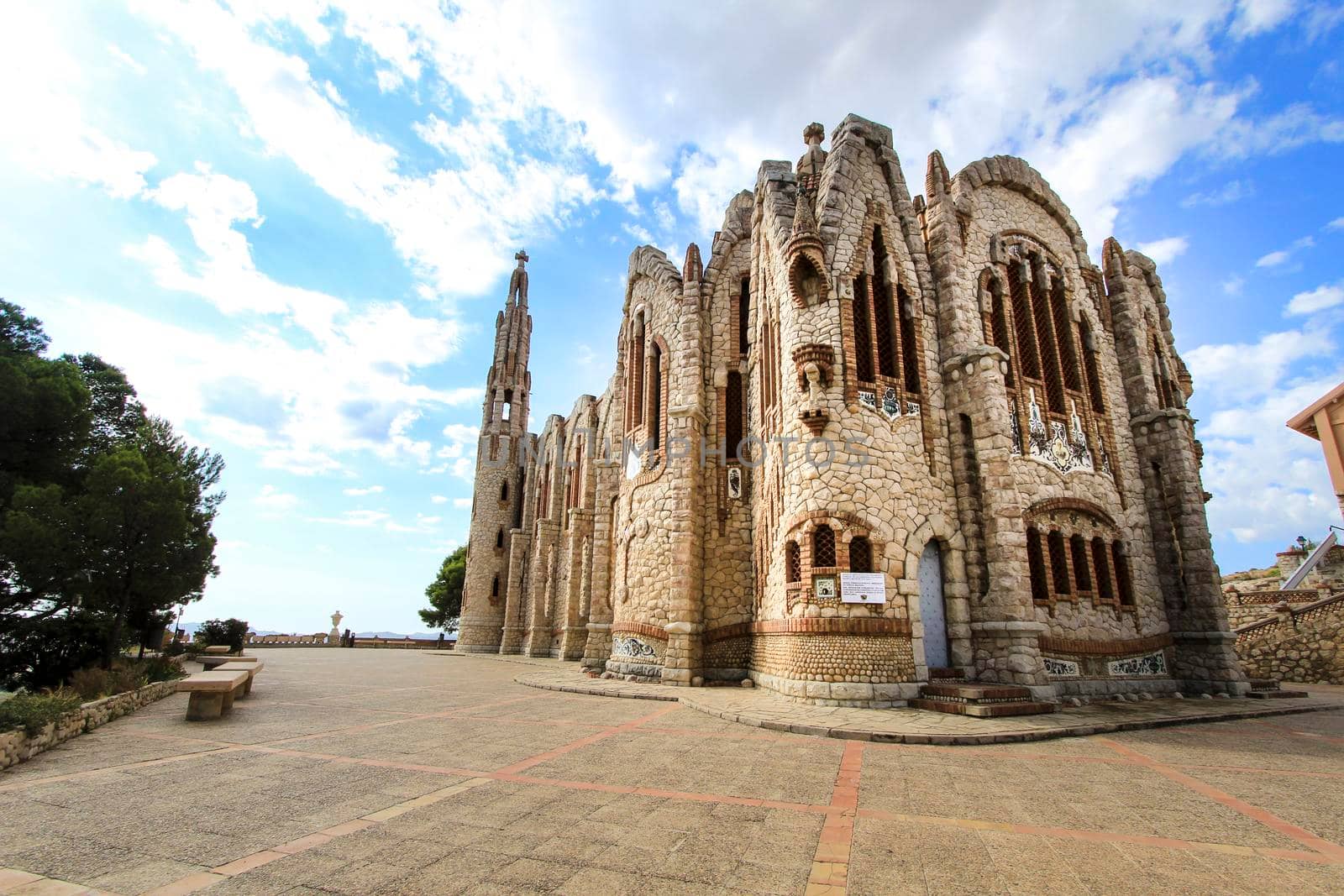 Novelda, Alicante, Spain- September 24, 2021: Details, archs, tower and pictures of Sanctuary of Santa Maria Magdalena on the top of the mountain in Novelda, Alicante, Spain.