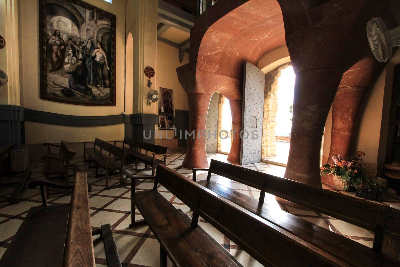 Novelda, Alicante, Spain- September 24, 2021: Details, archs, tower and pictures of Sanctuary of Santa Maria Magdalena on the top of the mountain in Novelda, Alicante, Spain.