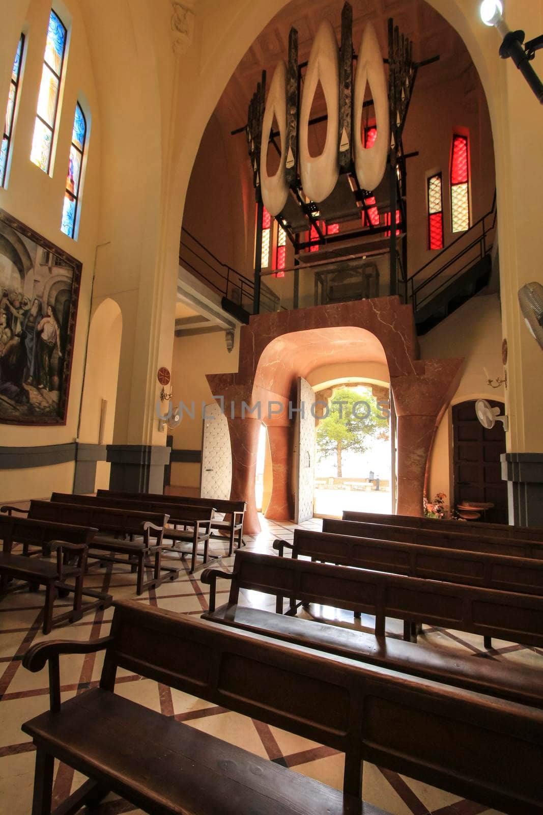 Novelda, Alicante, Spain- September 24, 2021: Details, archs, tower and pictures of Sanctuary of Santa Maria Magdalena on the top of the mountain in Novelda, Alicante, Spain.