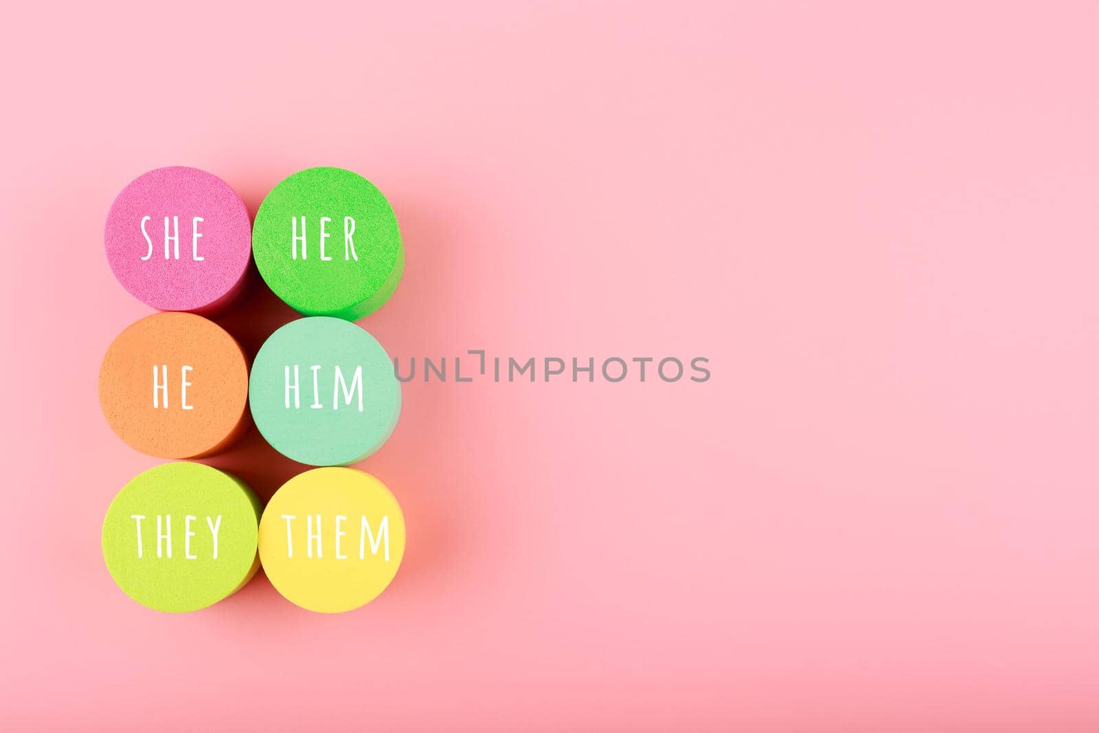 Correct pronouns for different genders on light pink background with copy space by Senorina_Irina