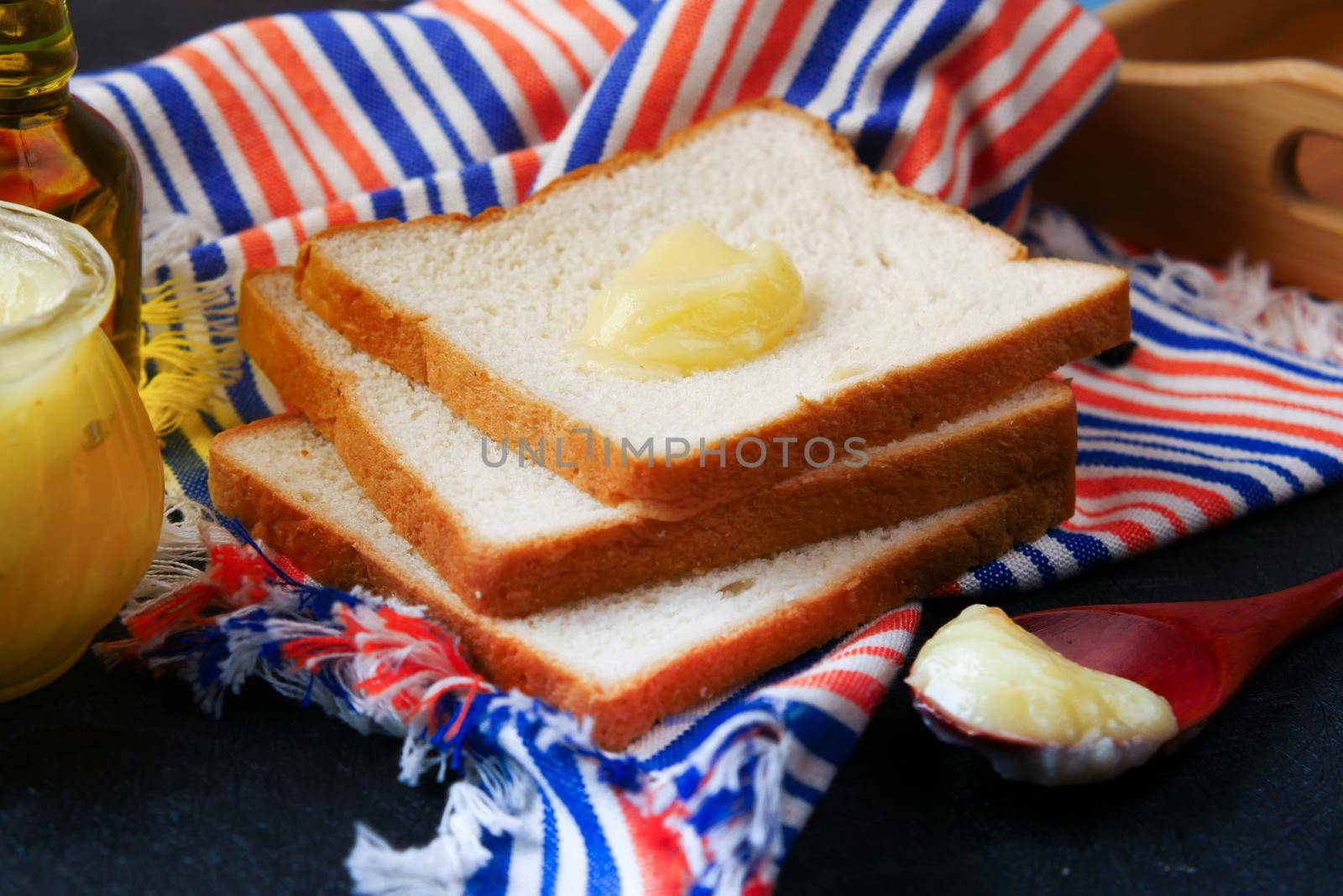 homemade ghee and breads on black background by towfiq007