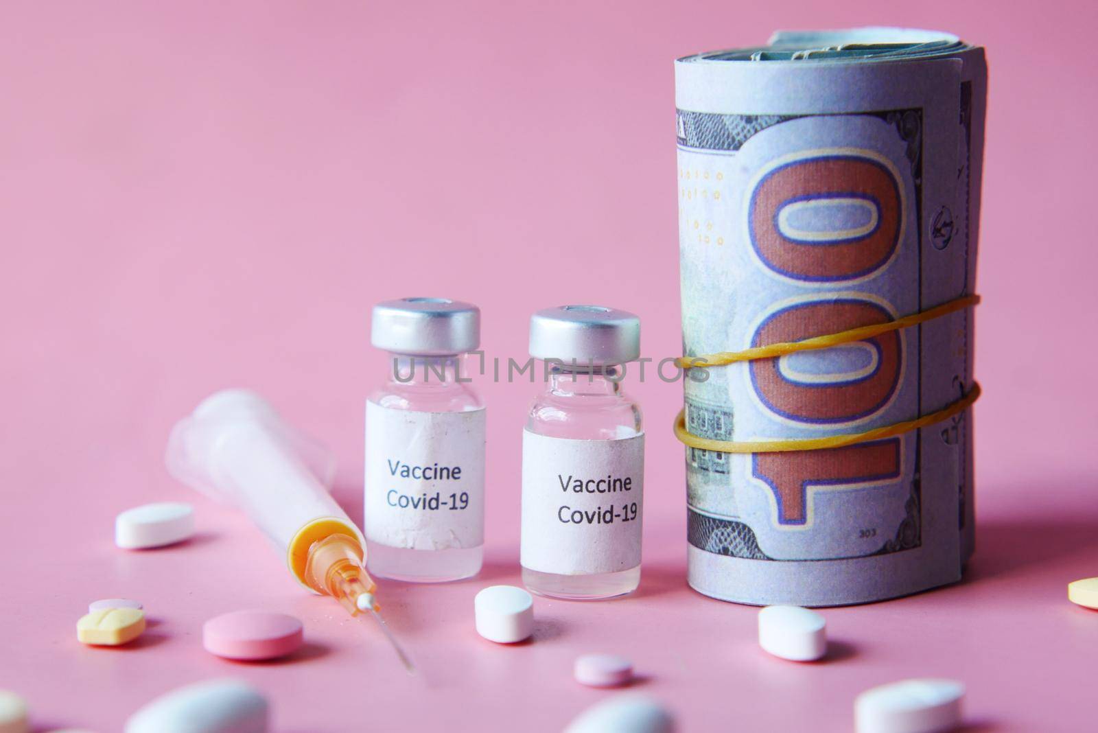Healthcare cost concept with us dollar, vaccine and pills .