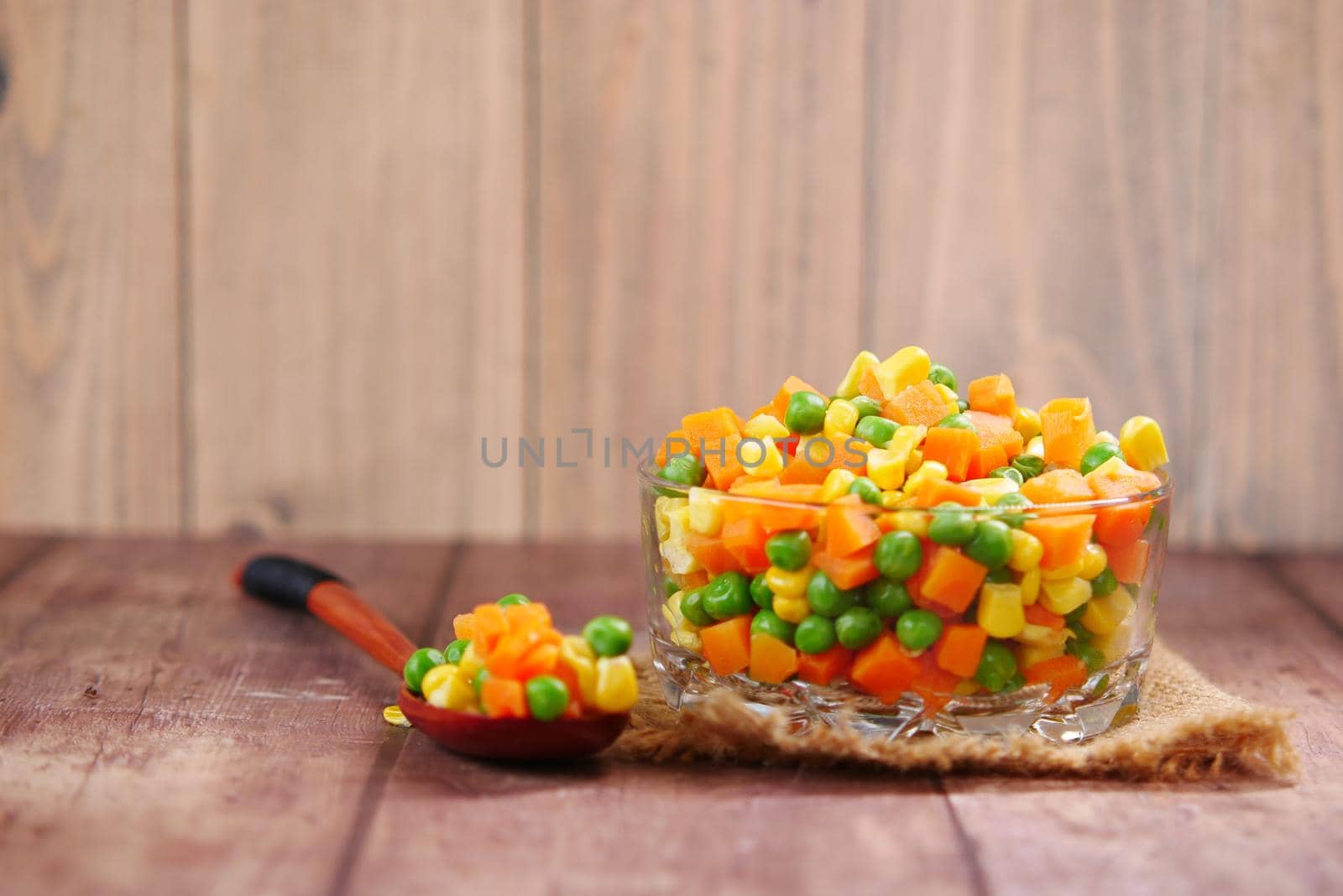 corn, carrot and beans in a bowl on table with copy space by towfiq007