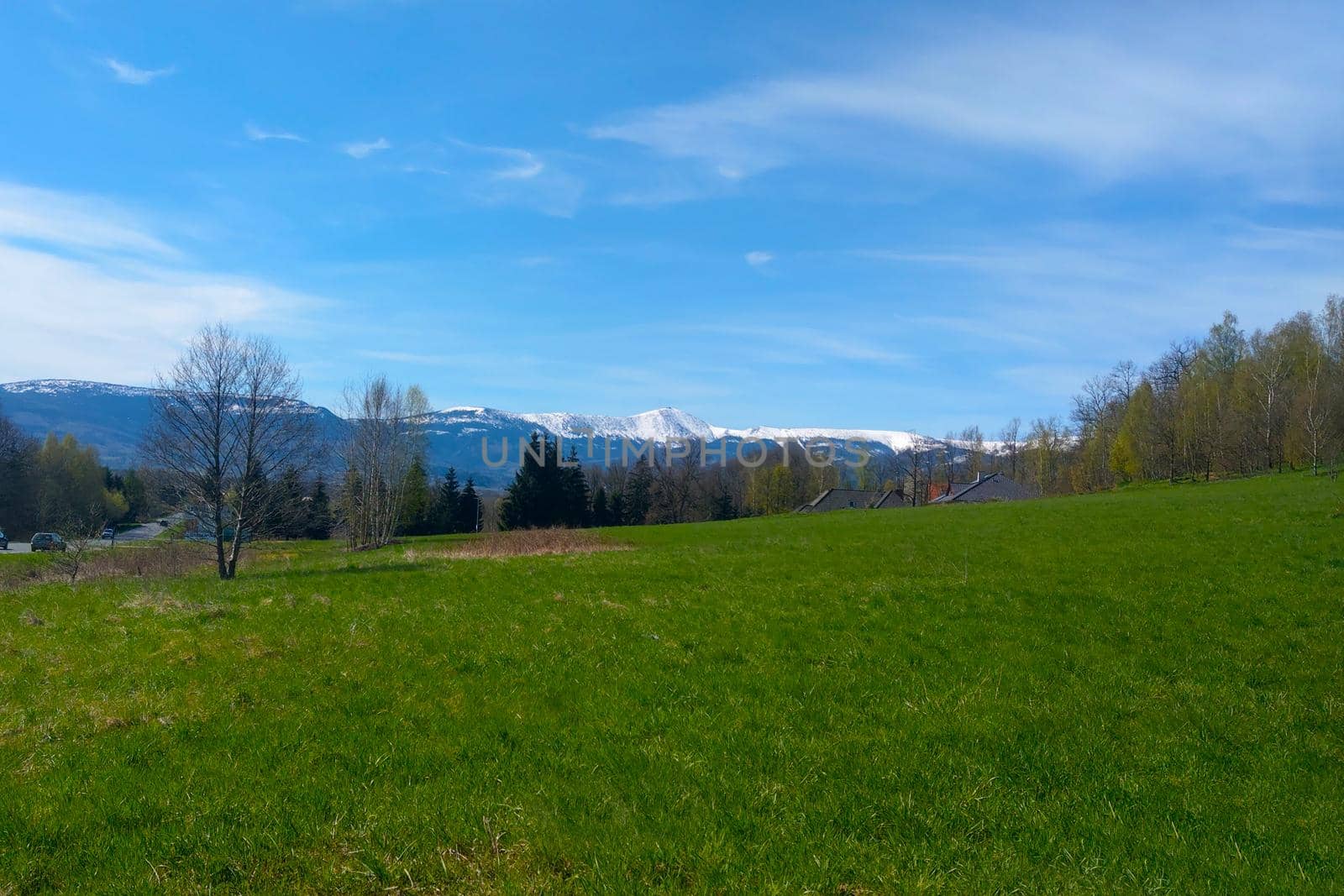 Picturesque view of the mountain with snow at the top on a sunny summer day. by kip02kas