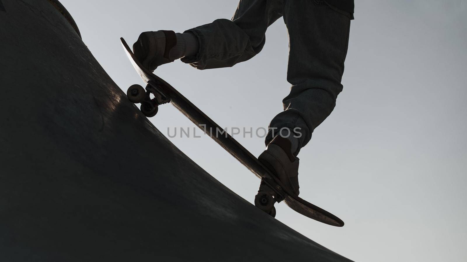 teenager having fun with skateboard park silhouette. High quality beautiful photo concept by Zahard