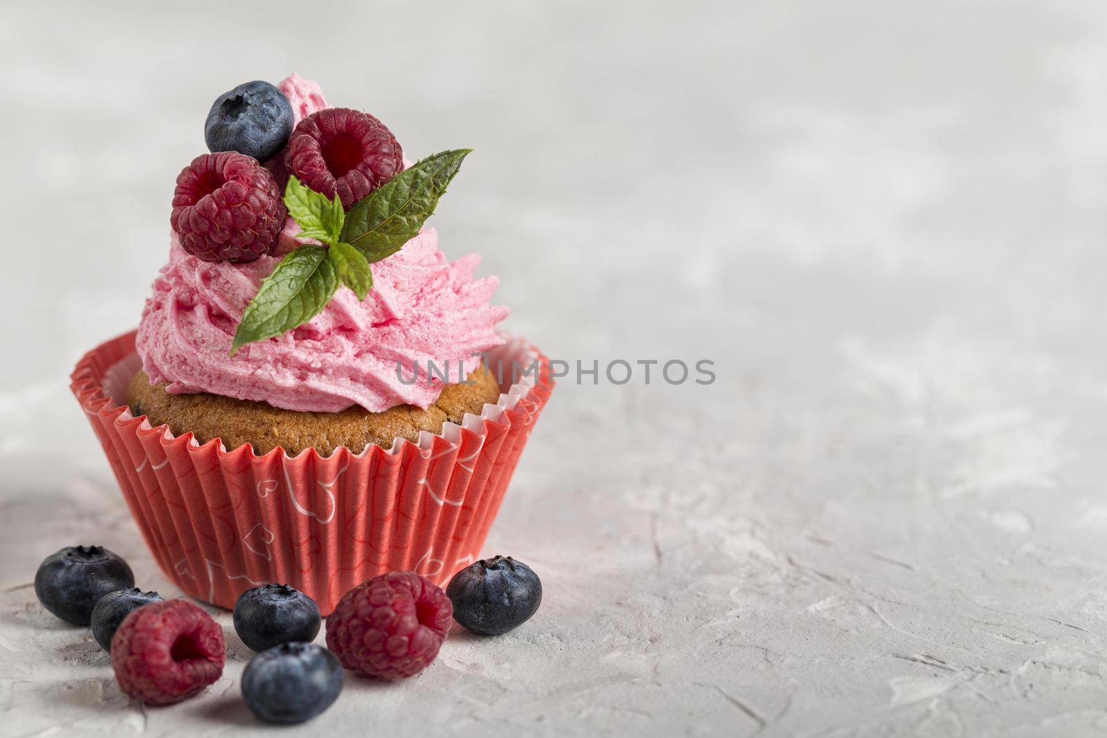 front view view tasty cupcake with strawberry cream. High quality beautiful photo concept by Zahard