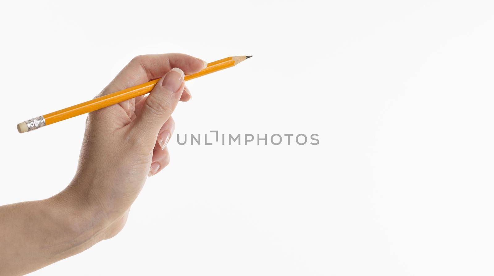 hand holding pencil with copy space. High quality beautiful photo concept by Zahard