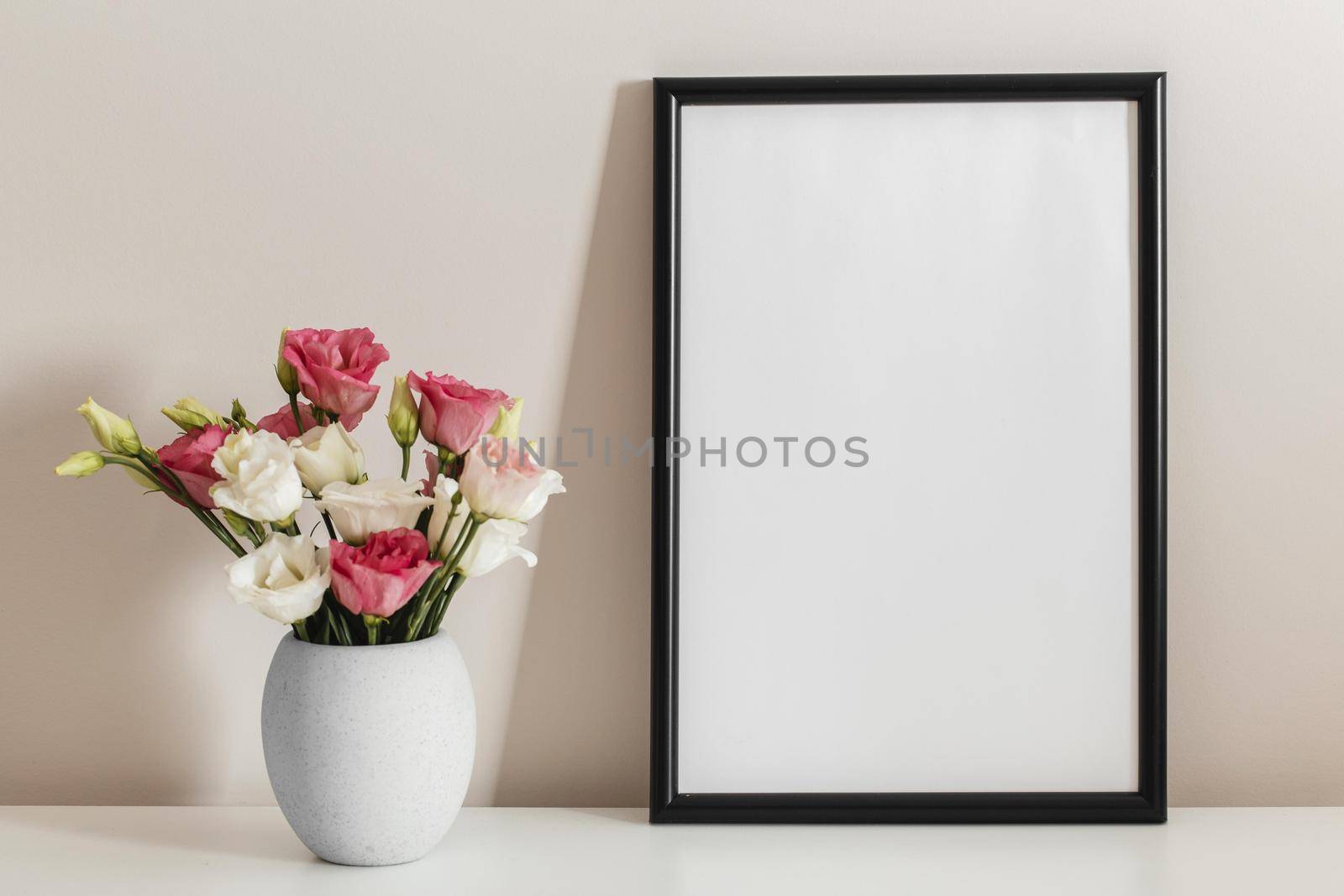 front view bouquet roses vase with empty frame. High quality beautiful photo concept by Zahard
