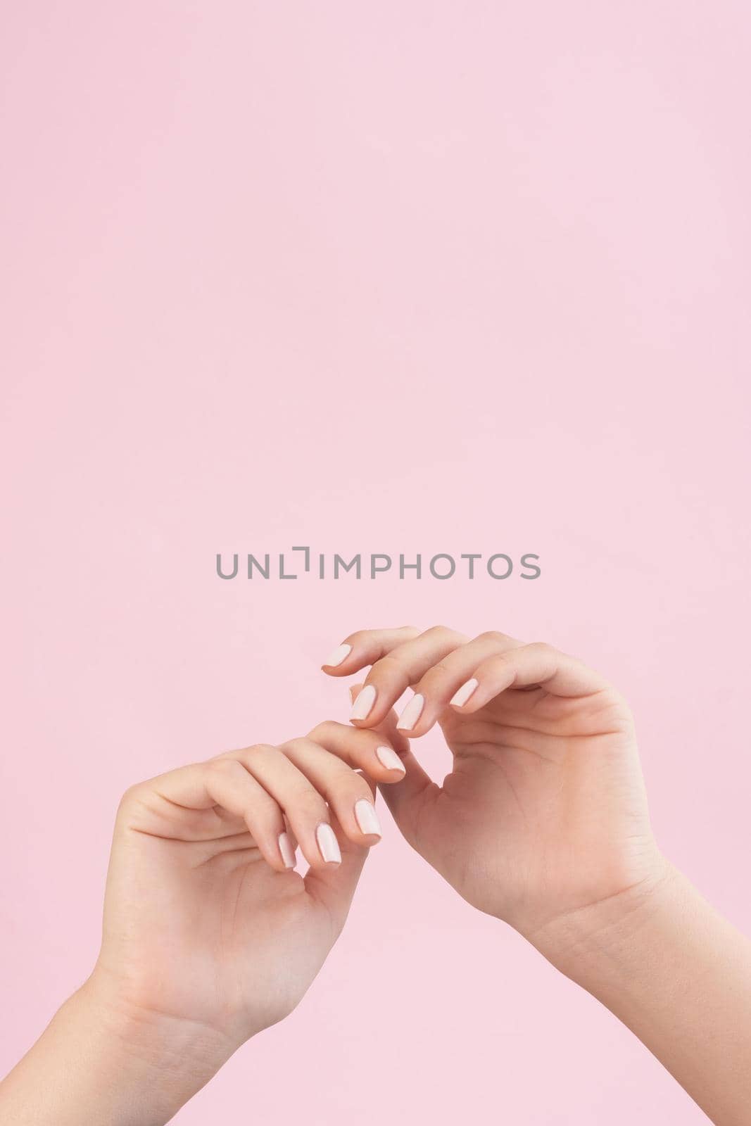 woman showing her manicure with copy space2. High quality beautiful photo concept by Zahard