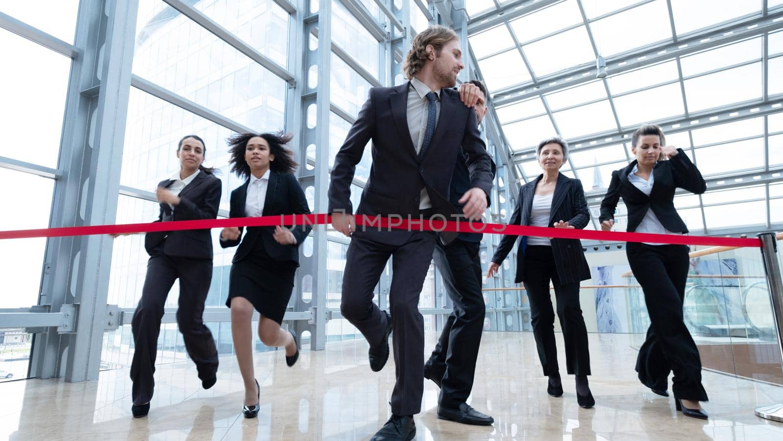 Businesspeople crossing the finish line rat race business people competition concept