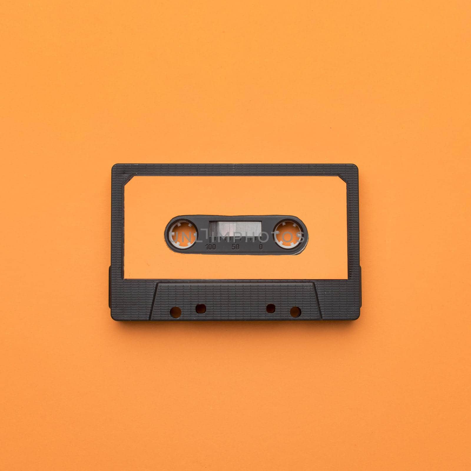 vintage cassette tape orange background. High quality beautiful photo concept by Zahard