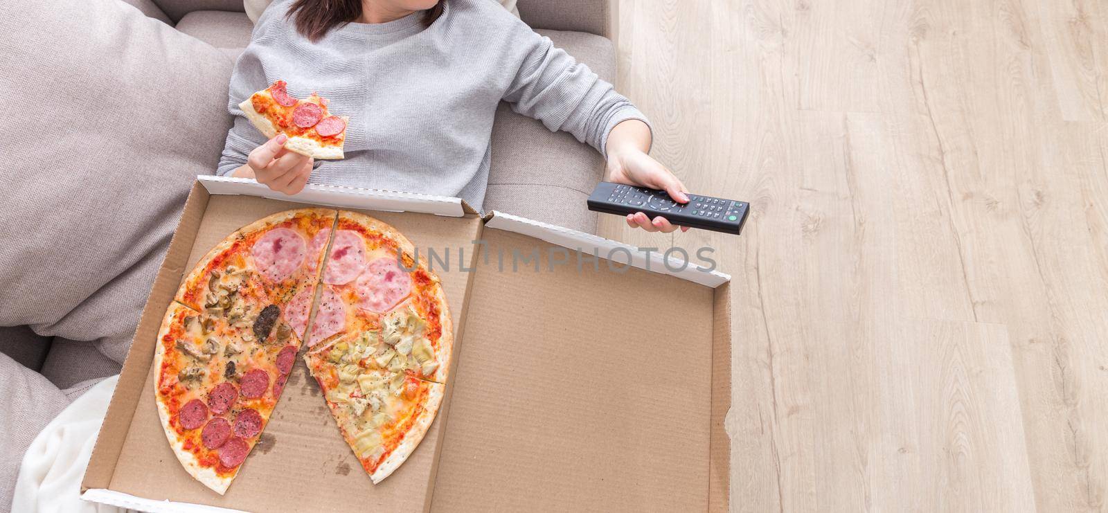 woman eating pizza image taken from above by Mariakray