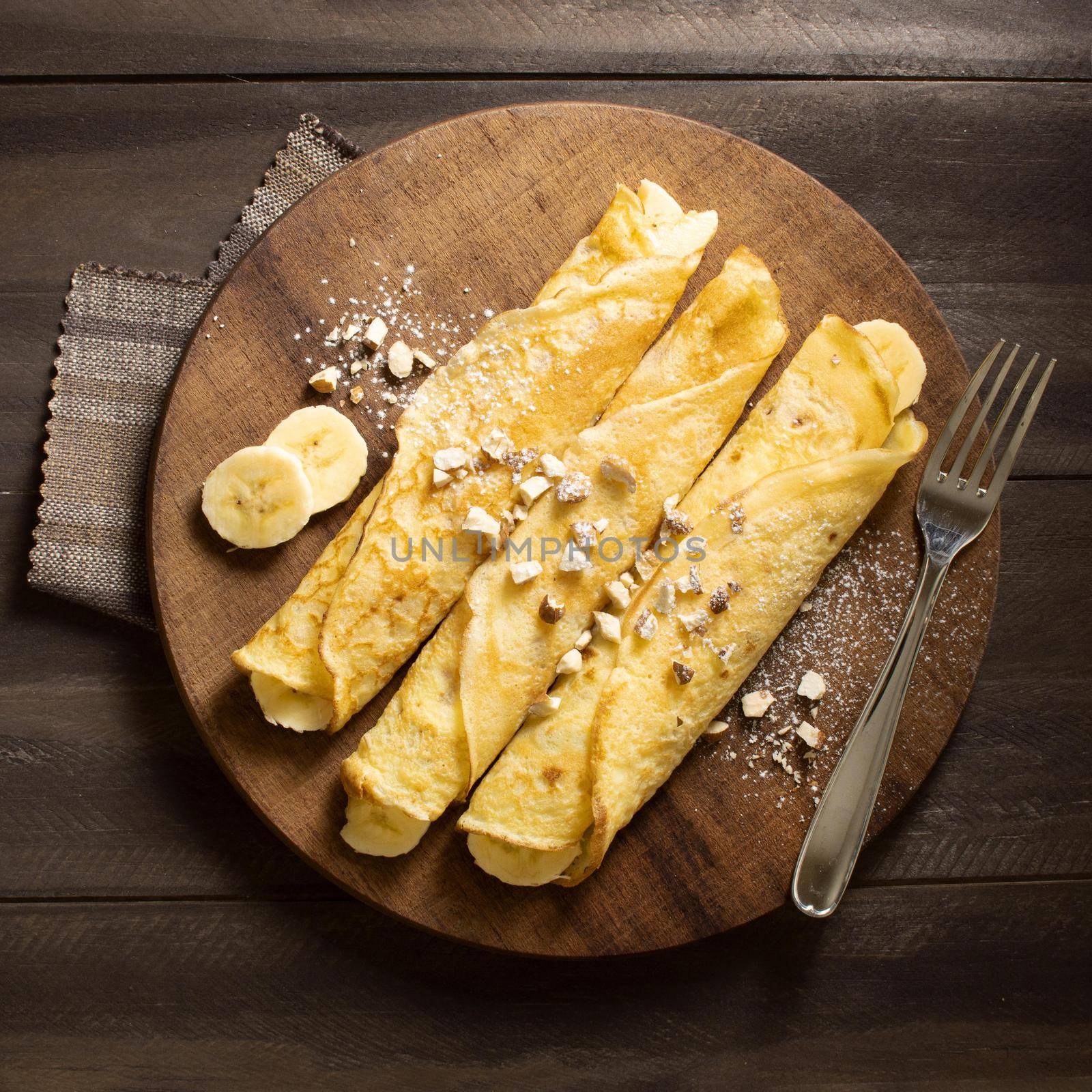 delicious winter crepe dessert with bananas. High quality beautiful photo concept by Zahard