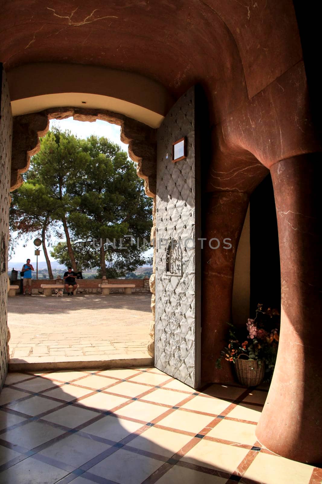 Novelda, Alicante, Spain- September 24, 2021: Details, archs, tower and pictures of Sanctuary of Santa Maria Magdalena on the top of the mountain in Novelda, Alicante, Spain.