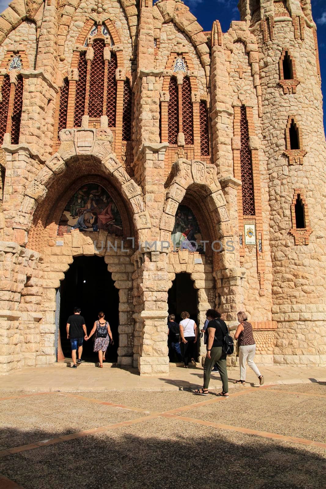 Novelda, Alicante, Spain- September 24, 2021: People visiting the Sanctuary of Santa Maria Magdalena on the top of the mountain in Novelda, Alicante, Spain.