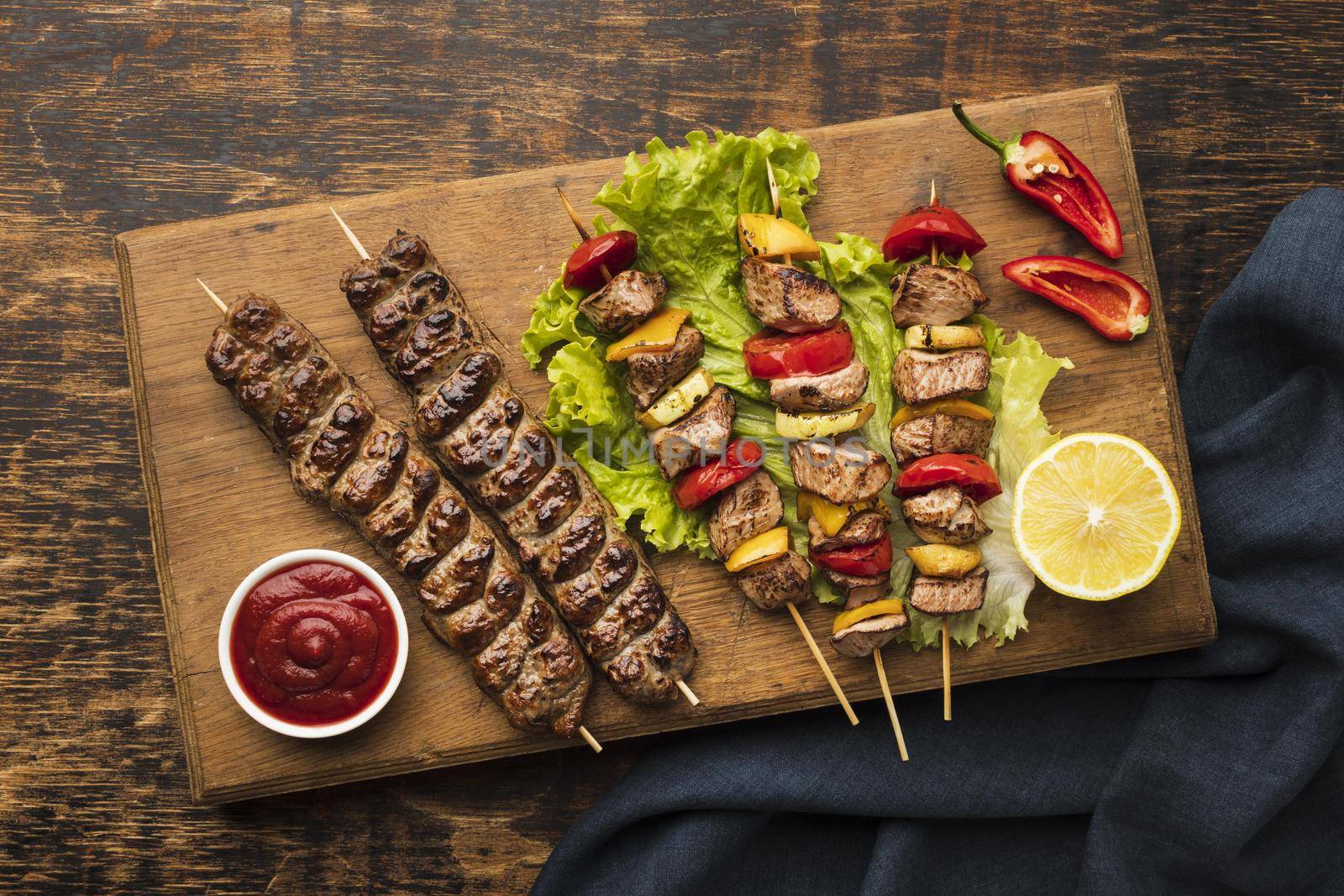 top view chopping board with delicious kebab lemon. High quality beautiful photo concept by Zahard