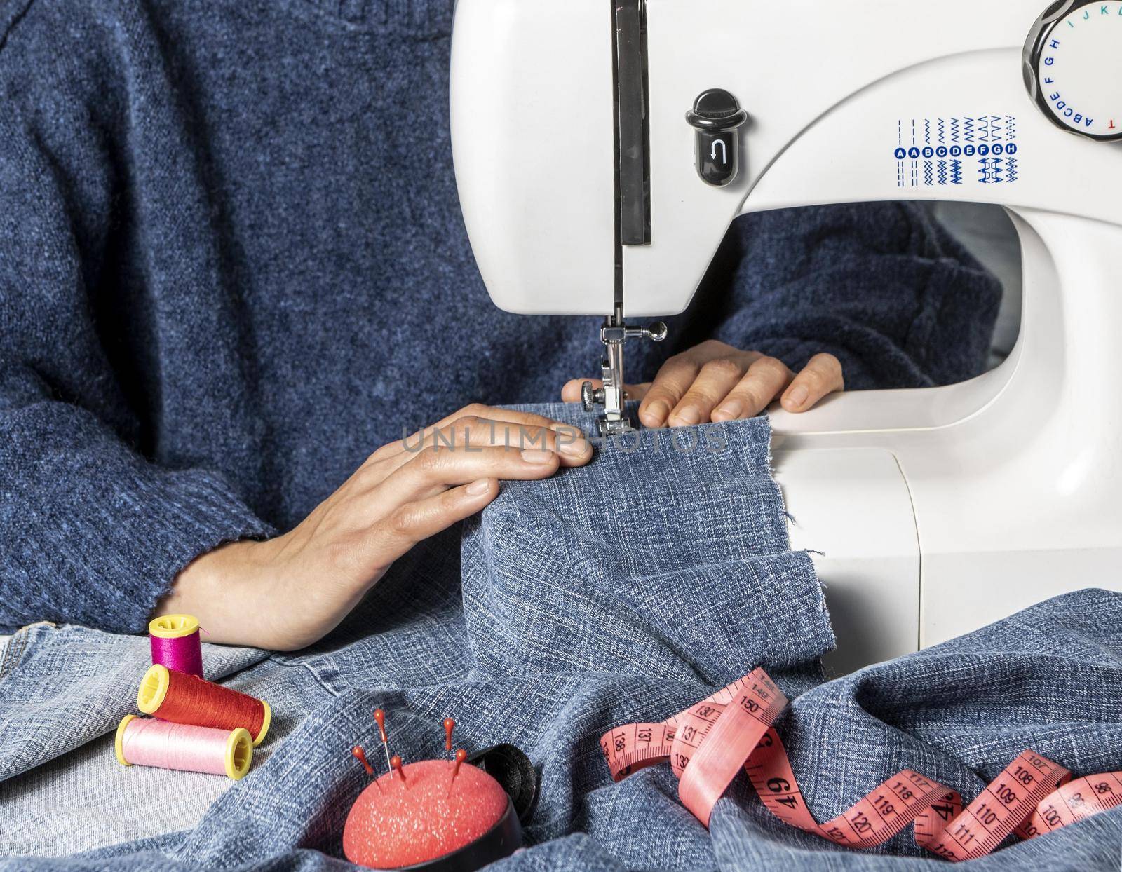 hands sewing with machine close up 2. High quality beautiful photo concept by Zahard