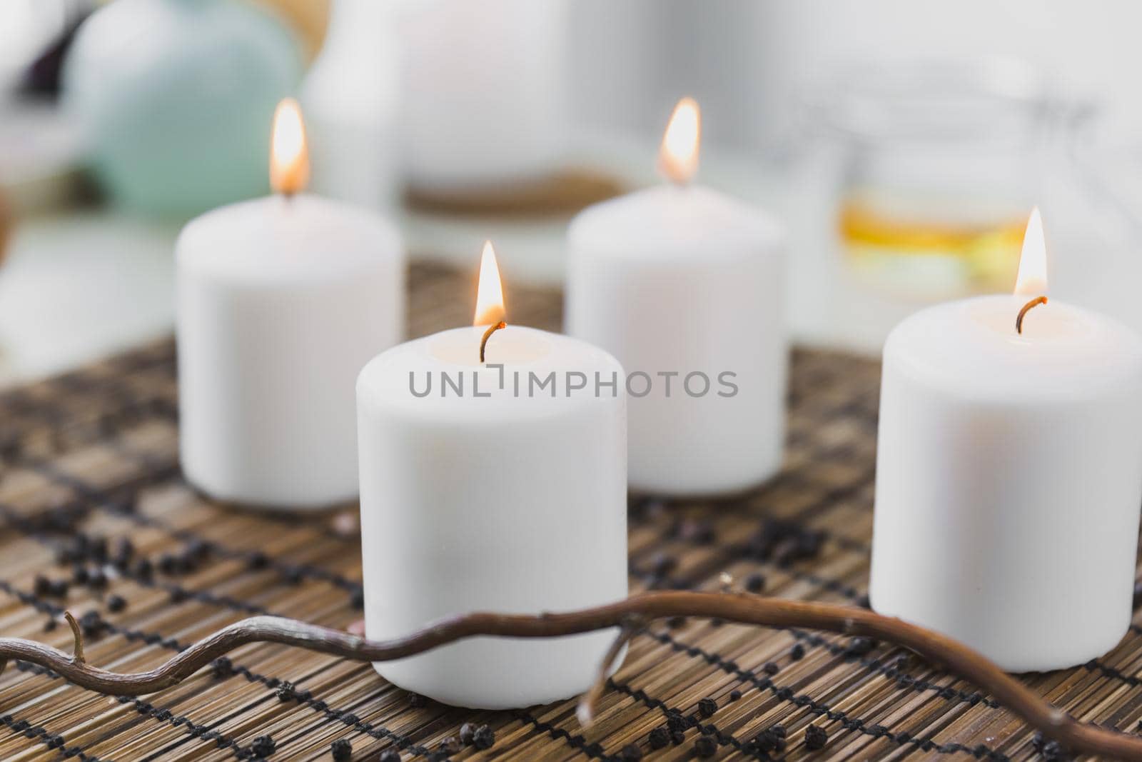 twig near flaming candles. High quality beautiful photo concept by Zahard