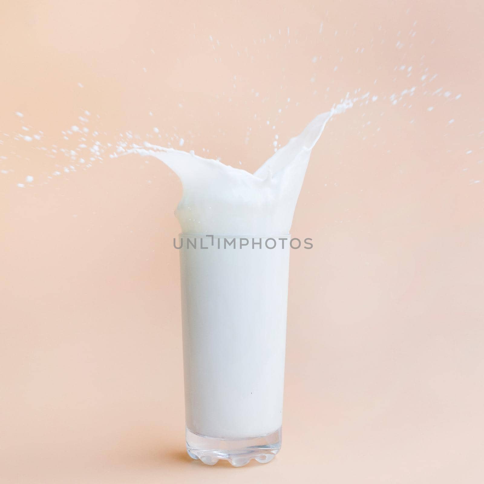 pouring milk out glass. High quality beautiful photo concept by Zahard