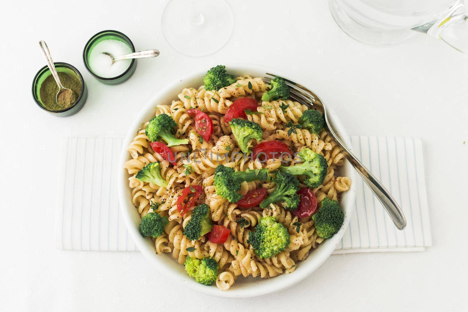 fusilli pasta salad with tomato broccoli napkin 2. High quality beautiful photo concept by Zahard