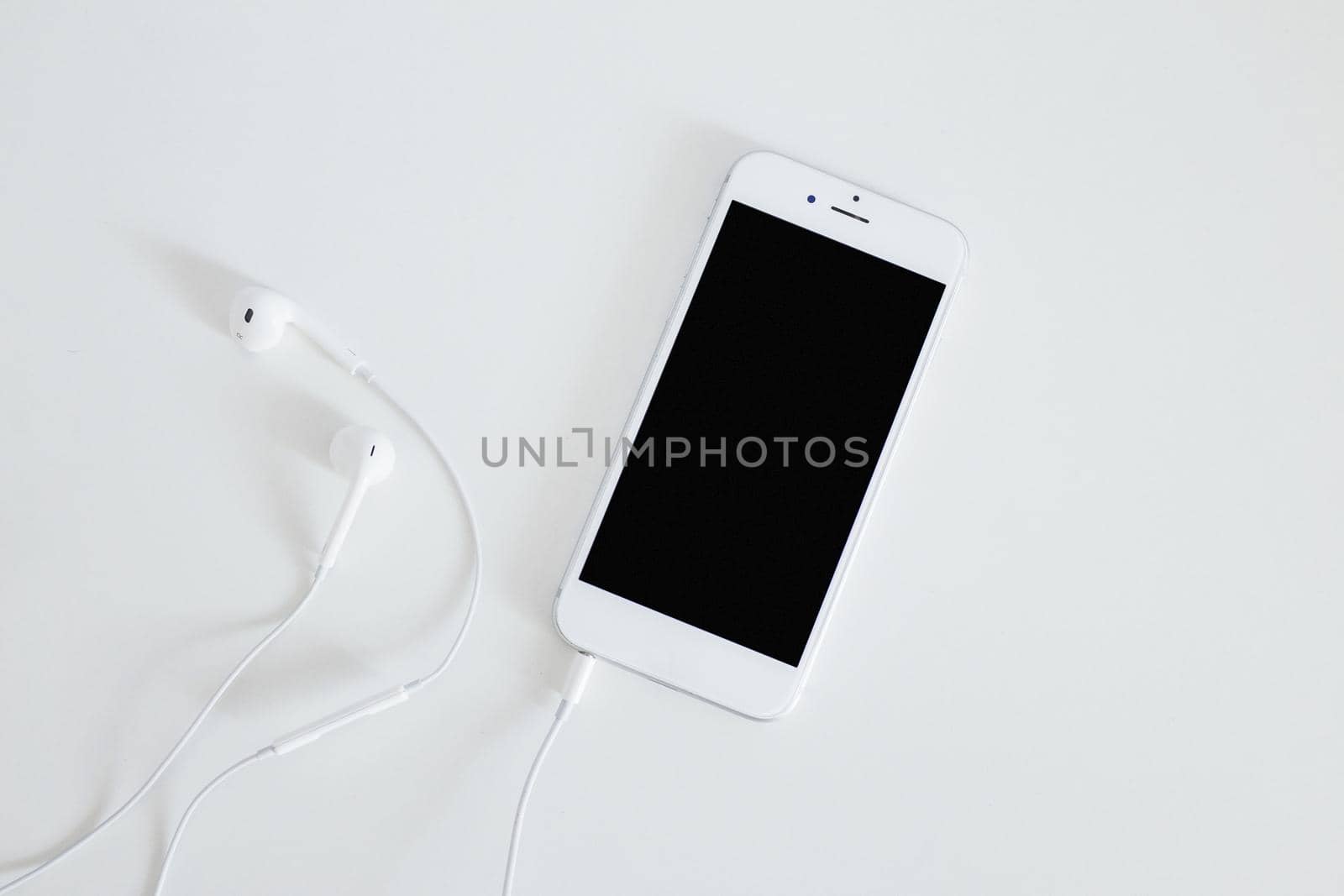 smartphone with earphone isolated white background. High quality beautiful photo concept by Zahard