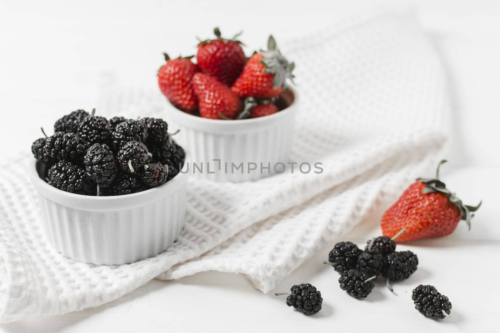 high angle strawberries mulberries bowls. High quality beautiful photo concept by Zahard