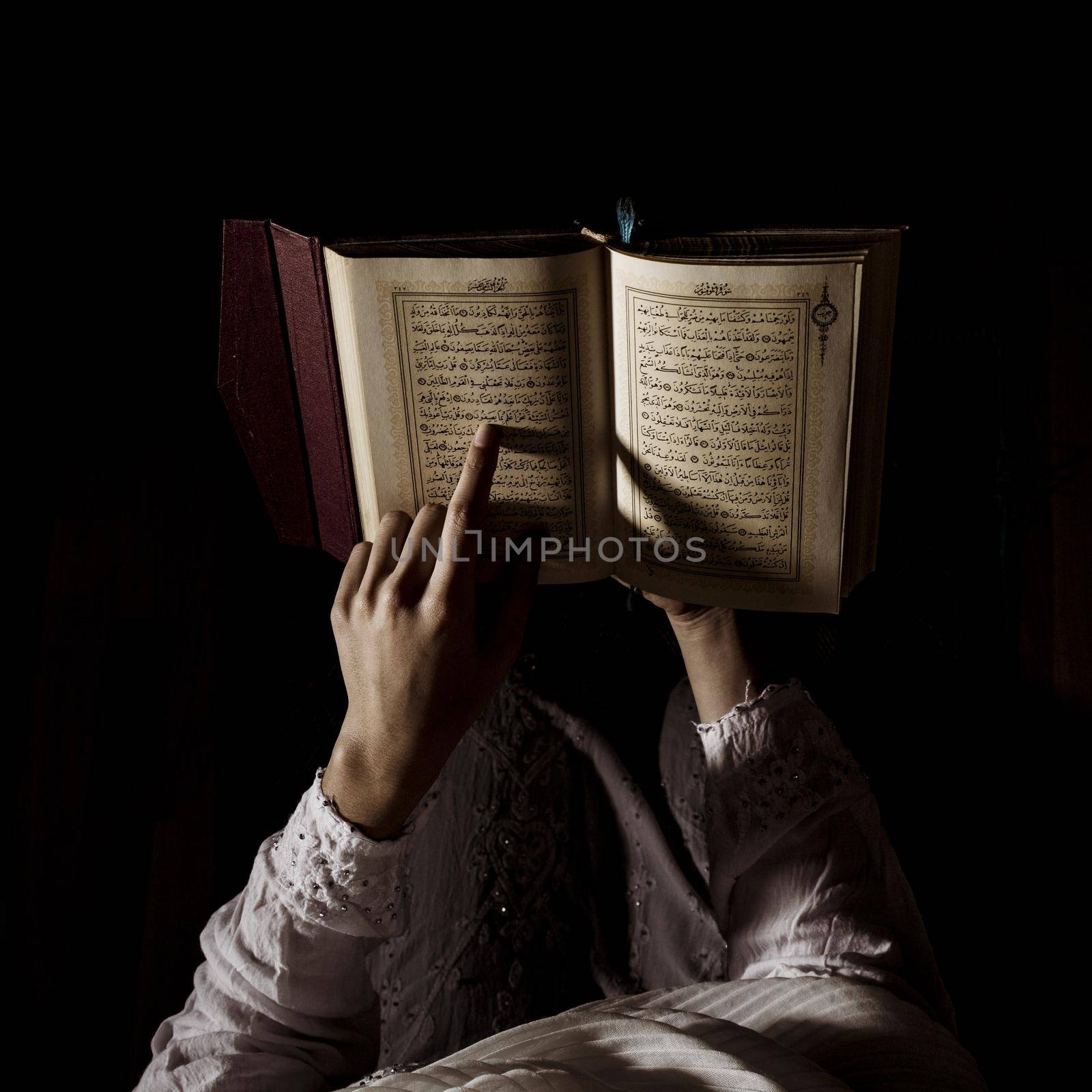 silhouette woman reading quran. High quality beautiful photo concept by Zahard