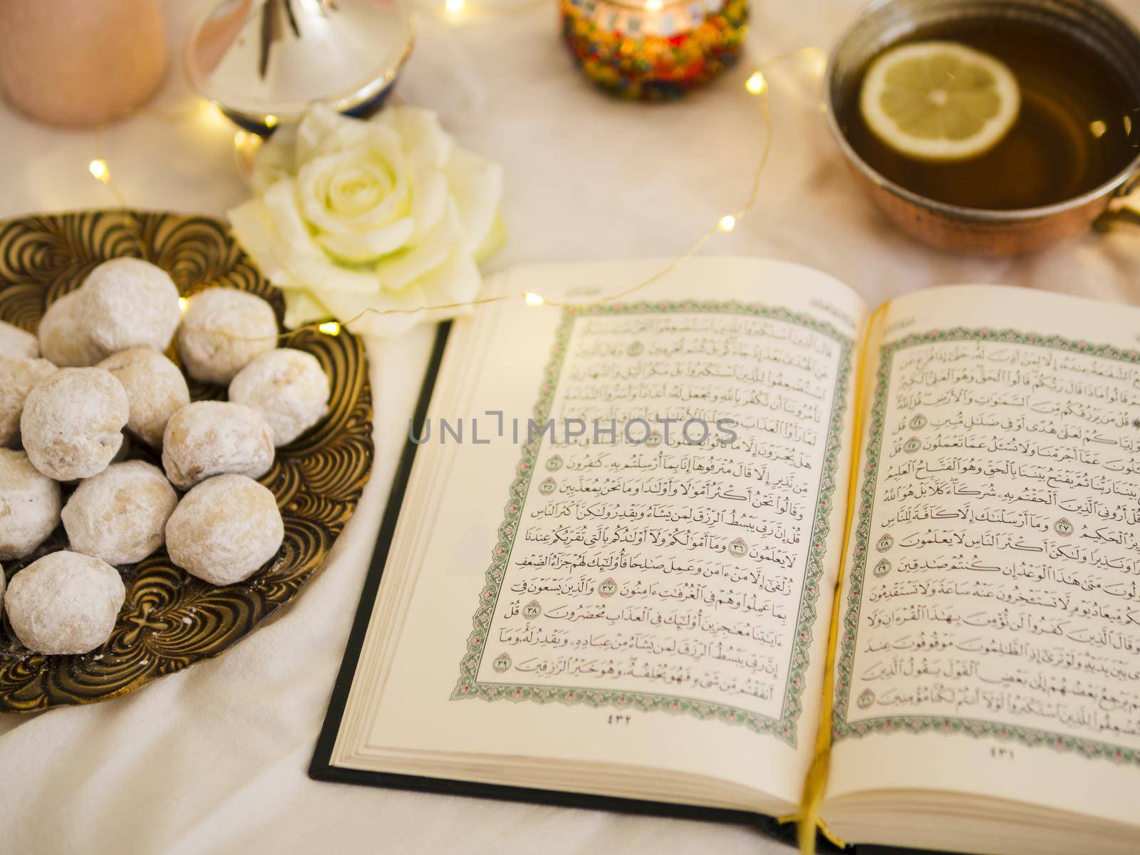 top view quran with tea pastry. High quality beautiful photo concept by Zahard