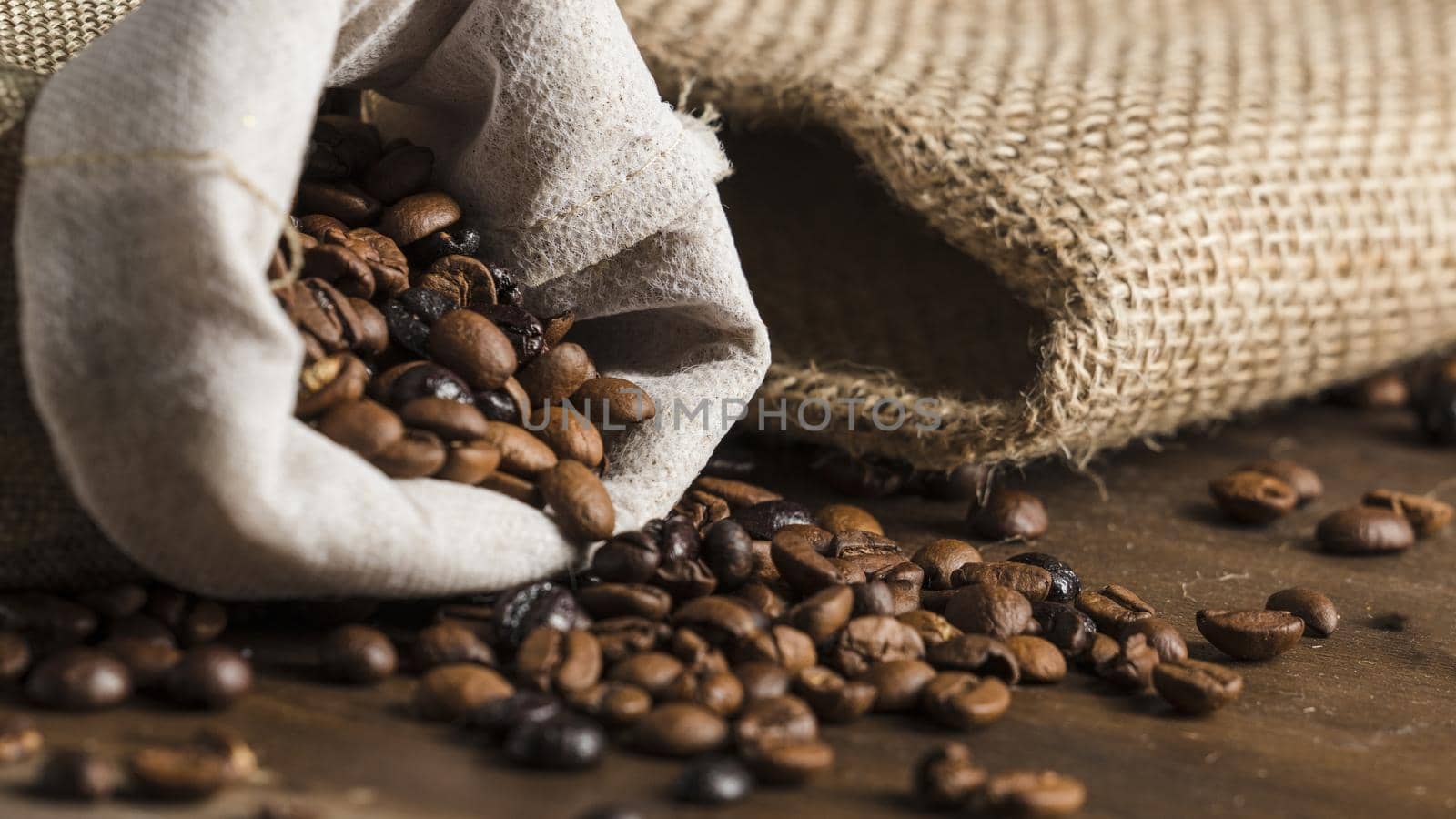 sack with coffee beans desk. High quality beautiful photo concept by Zahard