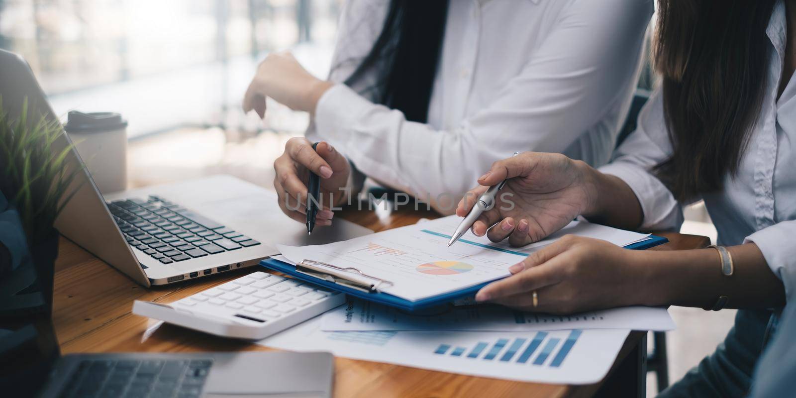 Analytics intelligence concept. Group of business people discuss current financial and economic on laptop for investment at the meeting by itchaznong