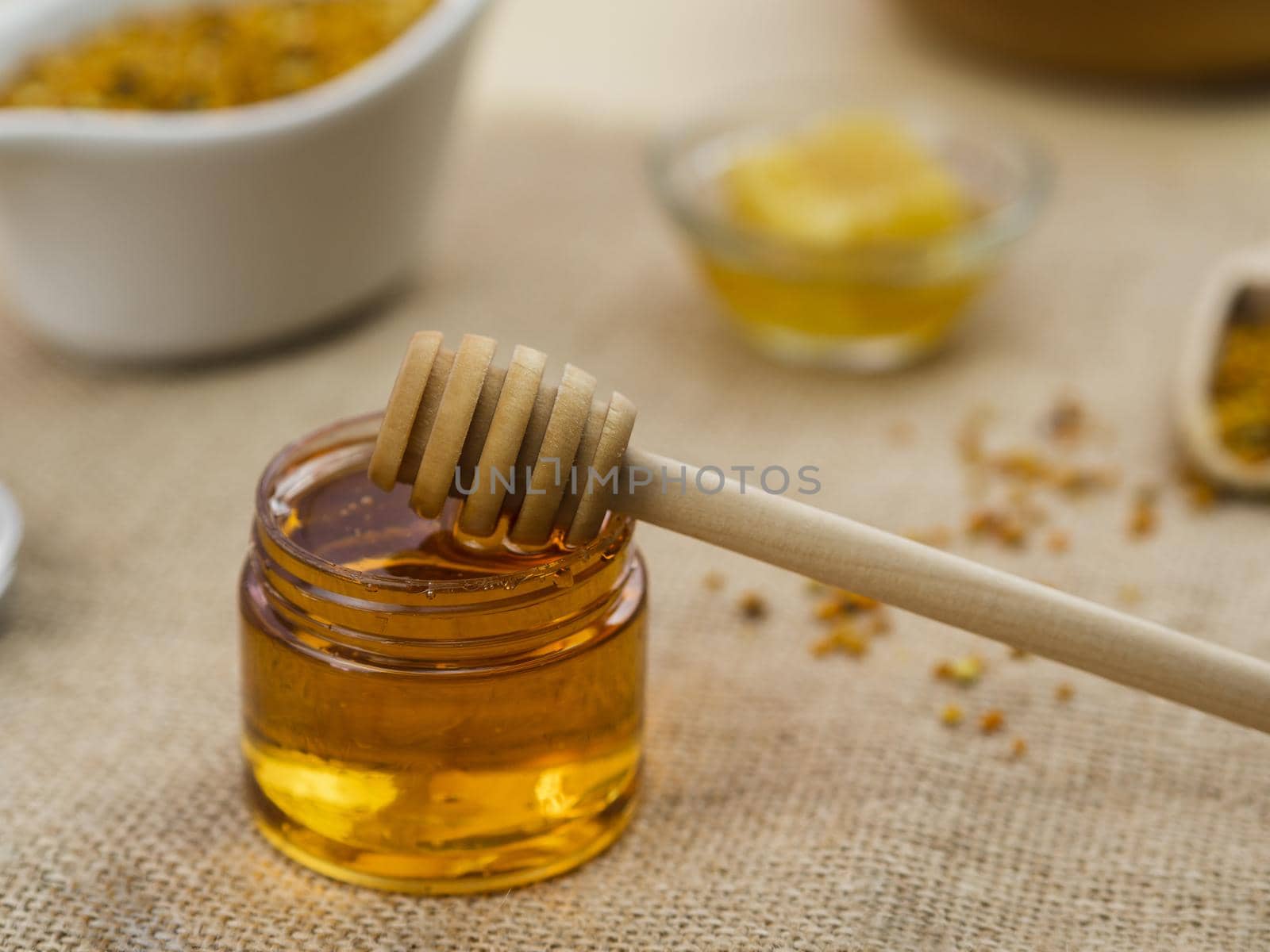 wooden dipper sticky honey. High quality beautiful photo concept by Zahard