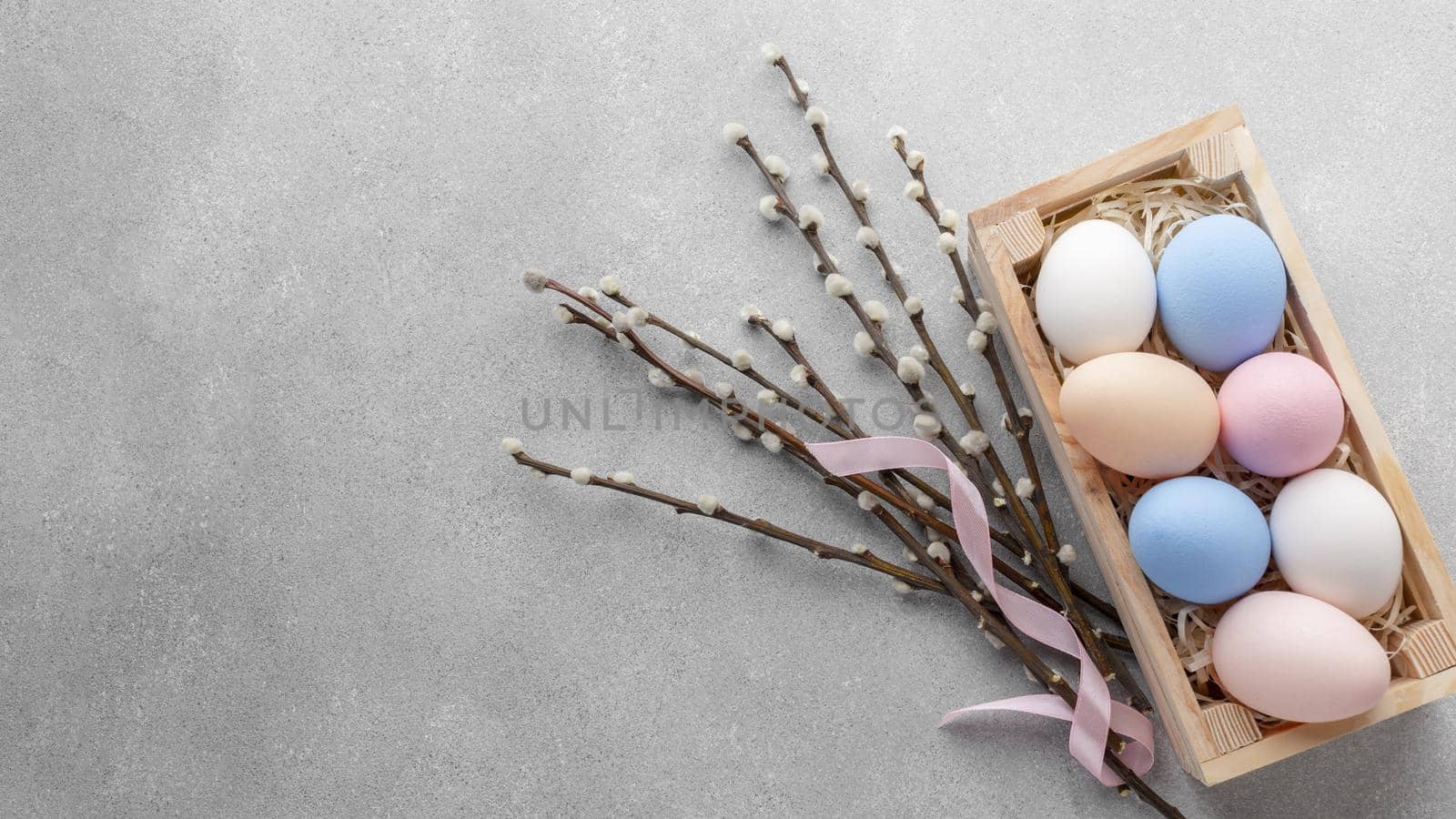 flat lay box with colorful easter eggs copy space. High quality beautiful photo concept by Zahard