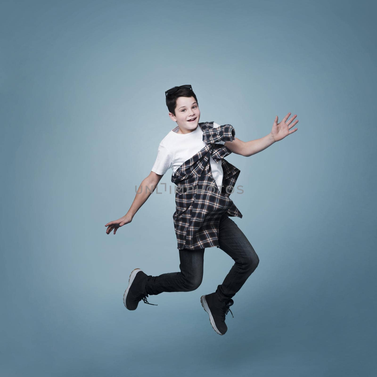 long shot boy jumping posing. High quality beautiful photo concept by Zahard