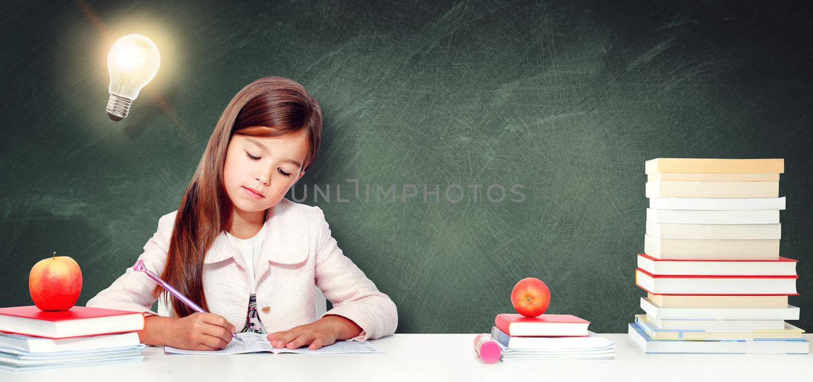 Young cute girl at chalkboard with light bulb over head by Taut