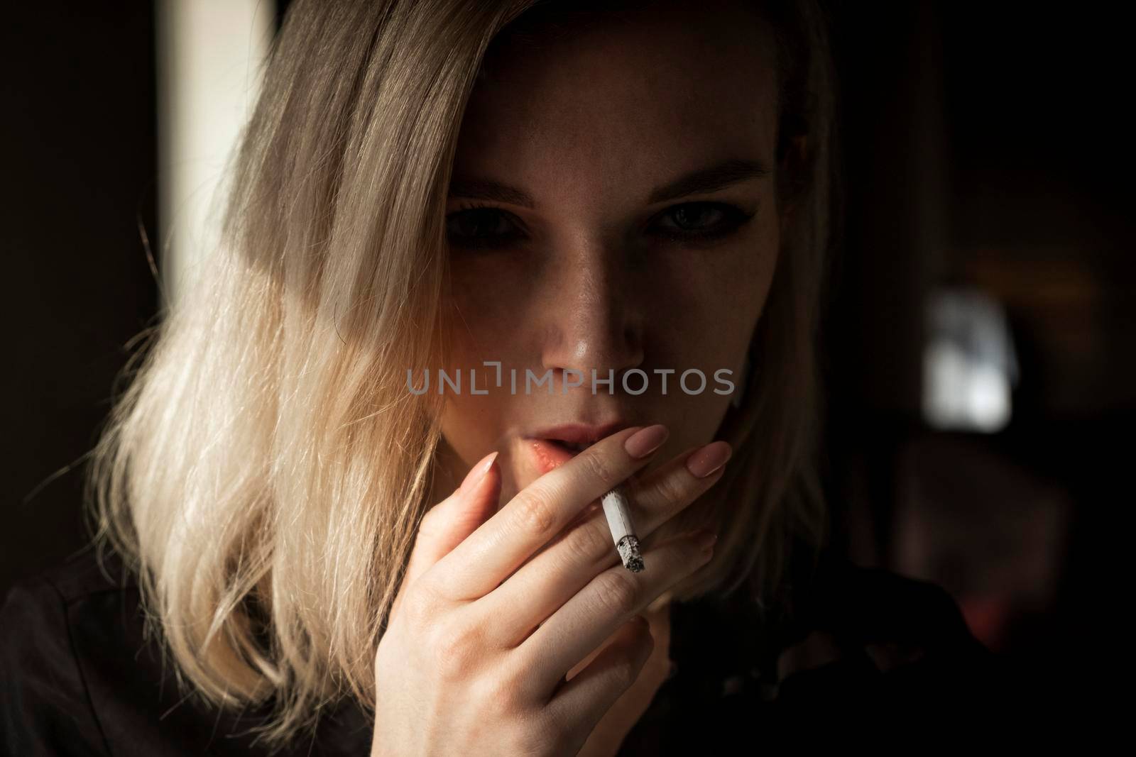 Young Woman Smoking Cigarette by snep_photo