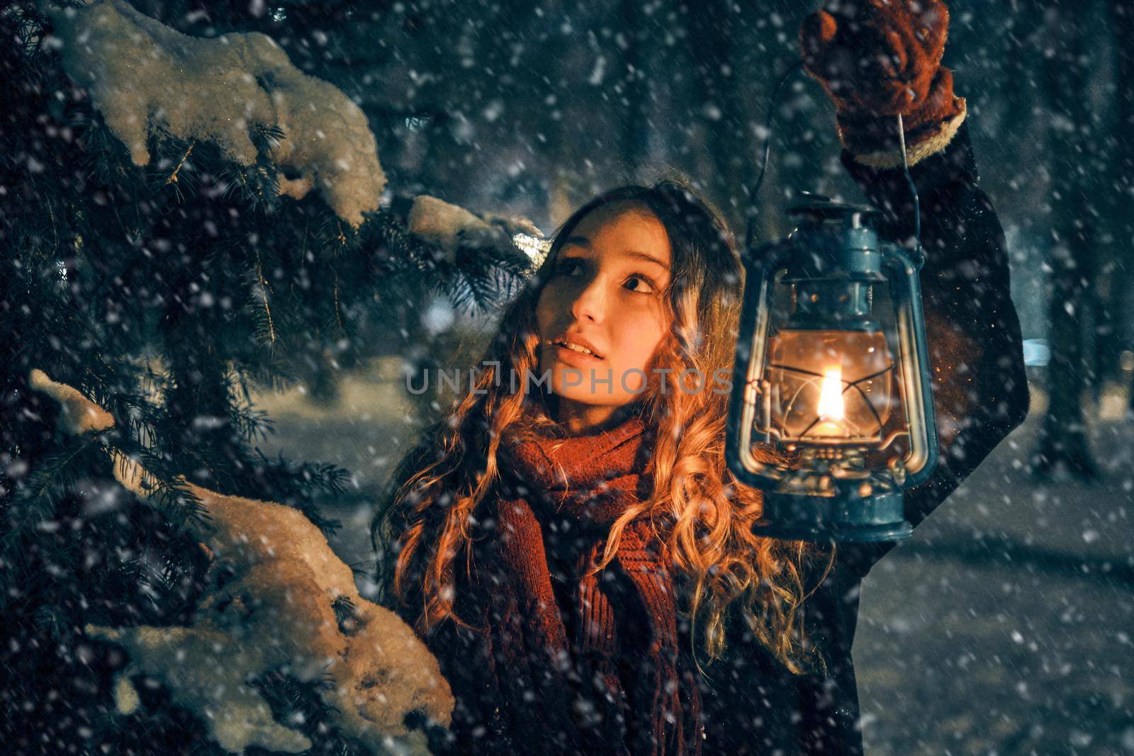 Young girl with lantern in winter forest fairy tale, book cover, christmas time