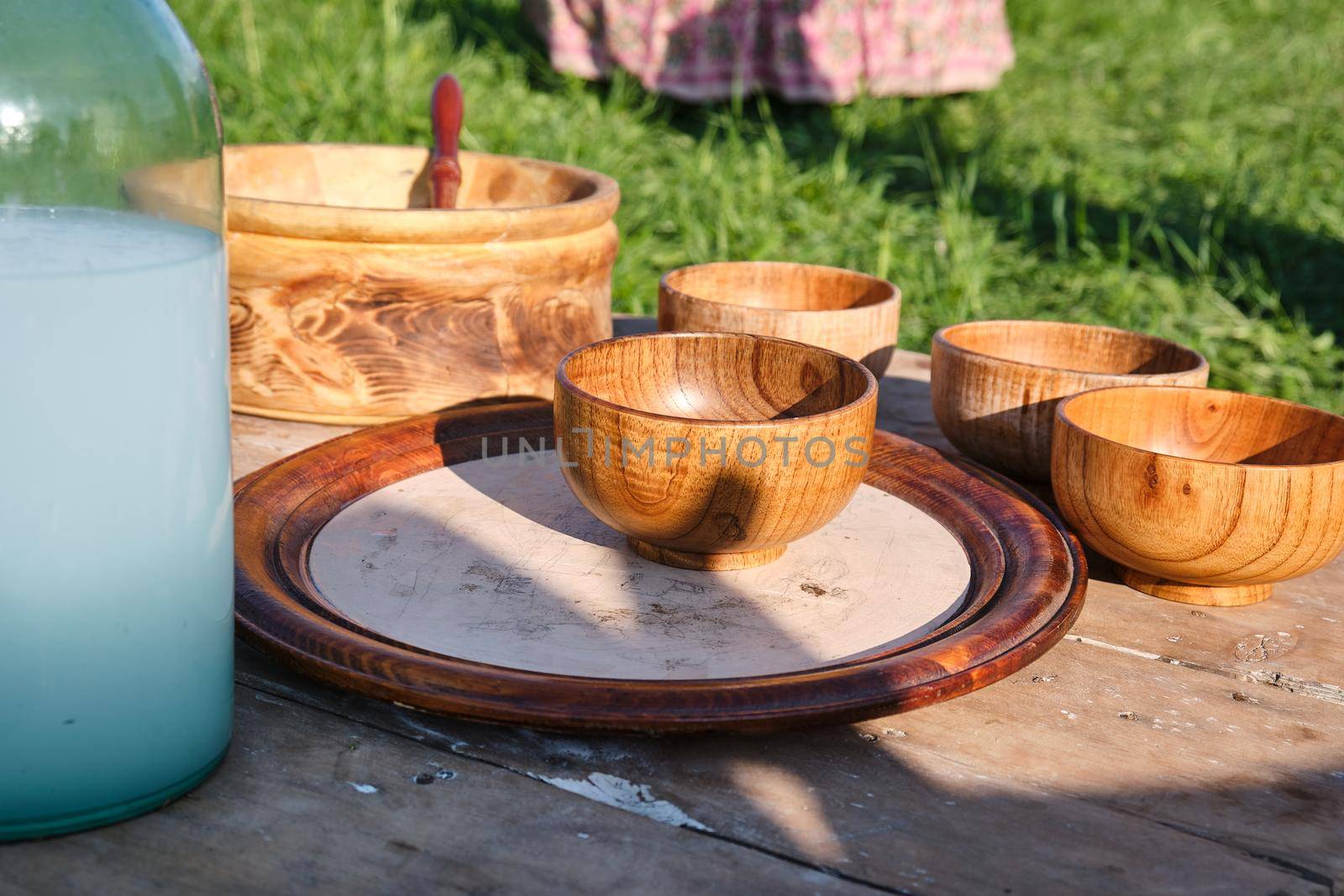 Wooden dishes on picknic table by snep_photo