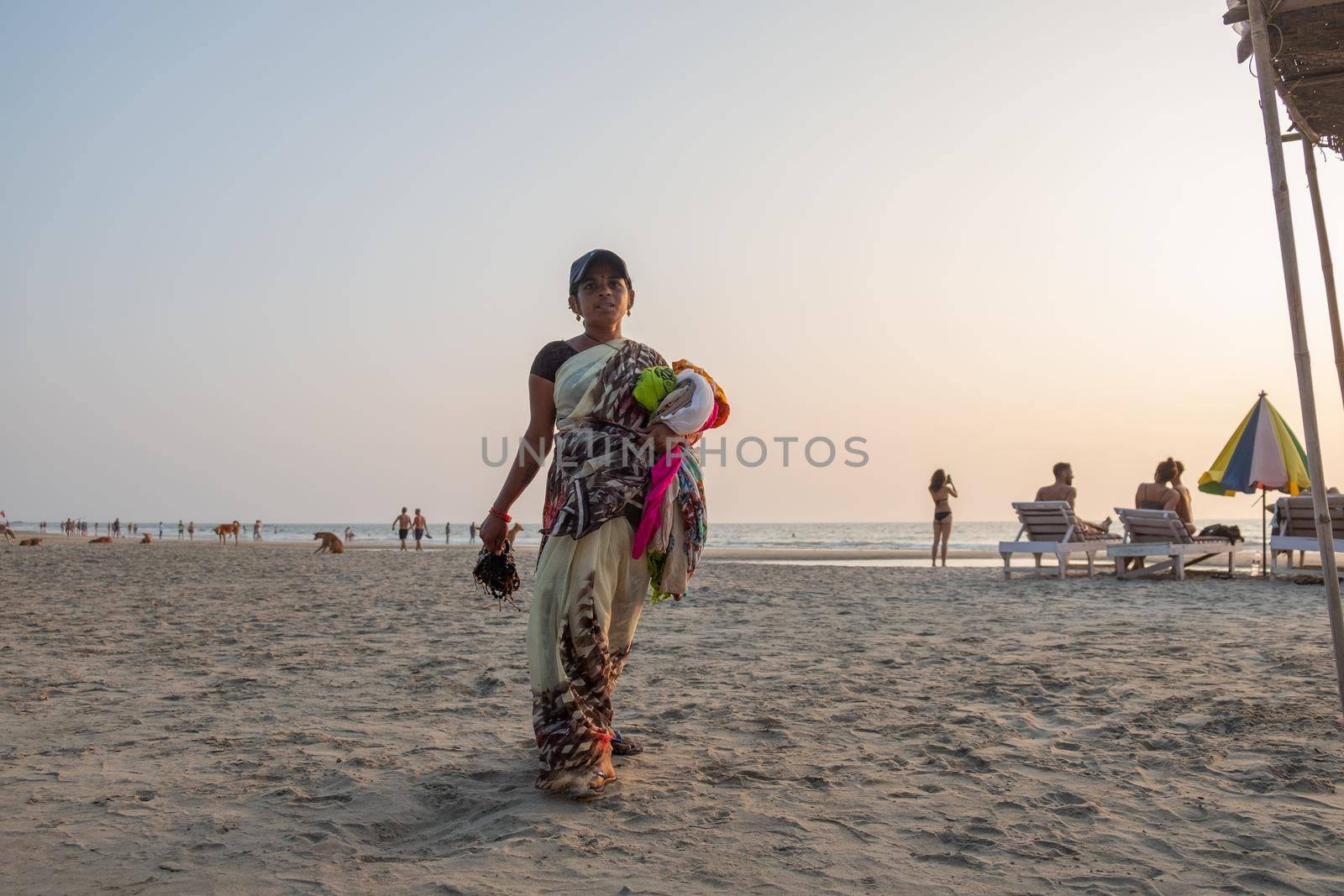 Indian woman souvenir seller on the beach, Goa, India