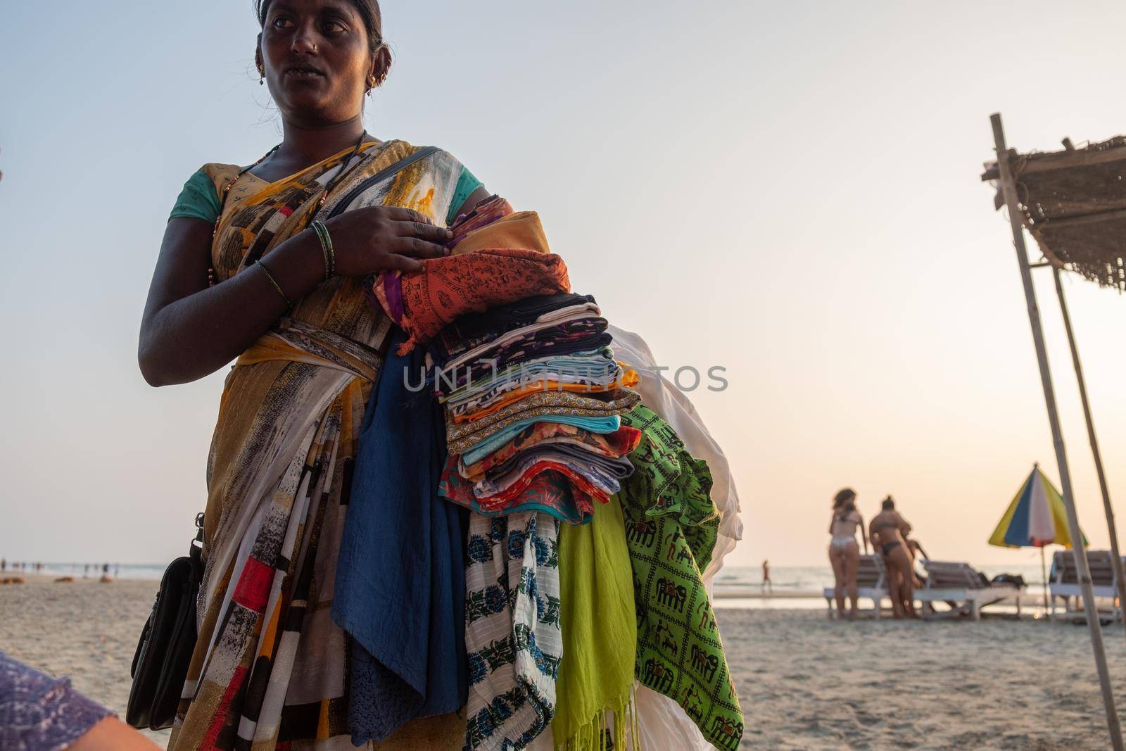 Indian woman souvenir seller on the beach by snep_photo