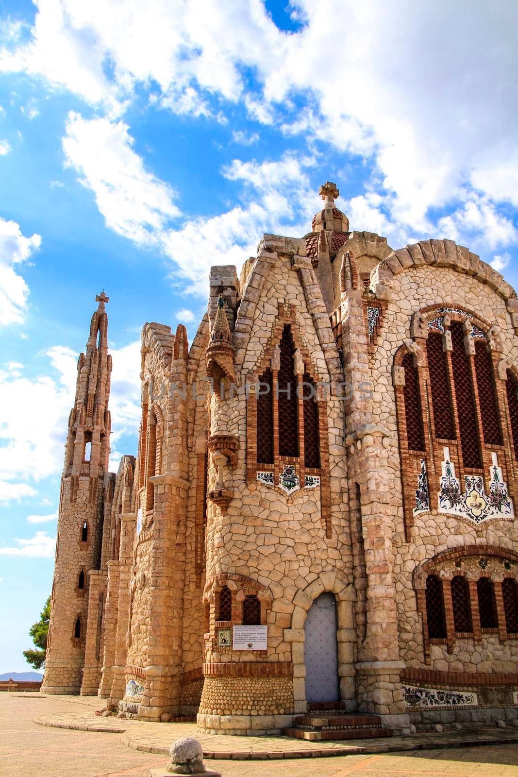 Novelda, Alicante, Spain- September 24, 2021: Details, archs, tower and pictures of Sanctuary of Santa Maria Magdalena on the top of the mountain in Novelda, Alicante, Spain.