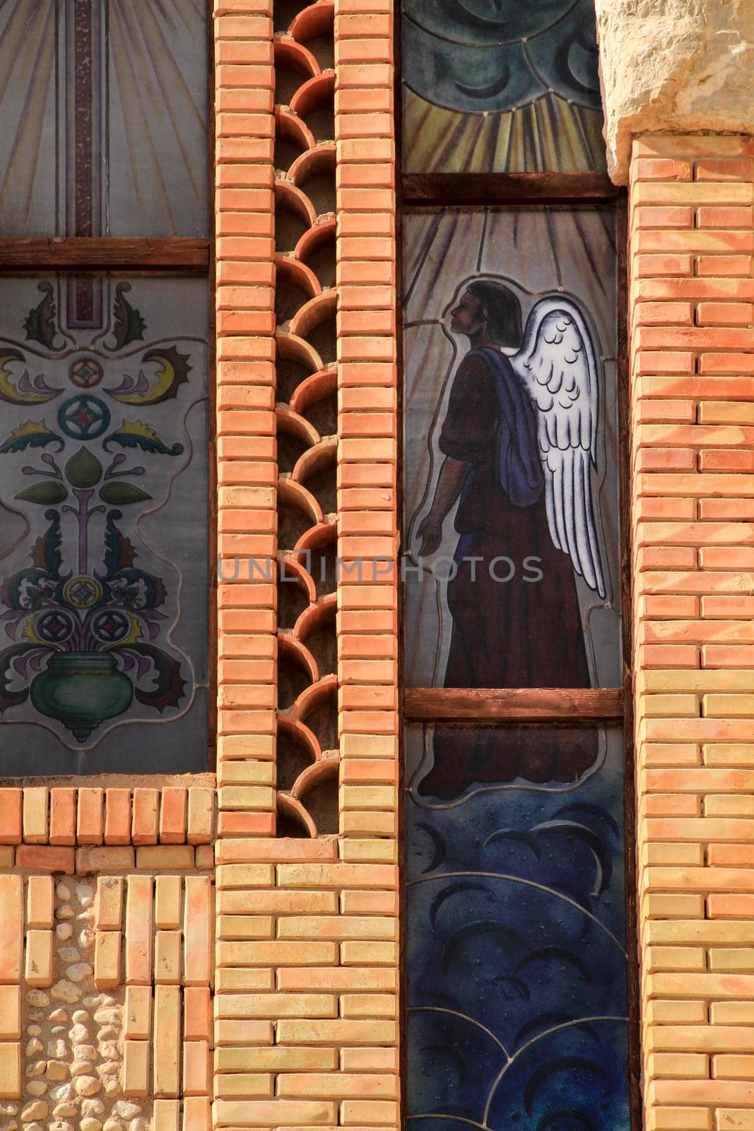 Novelda, Alicante, Spain- September 24, 2021: Guardian angel on stained glass in the Sanctuary of Santa Maria Magdalena on the top of the mountain in Novelda, Alicante, Spain.