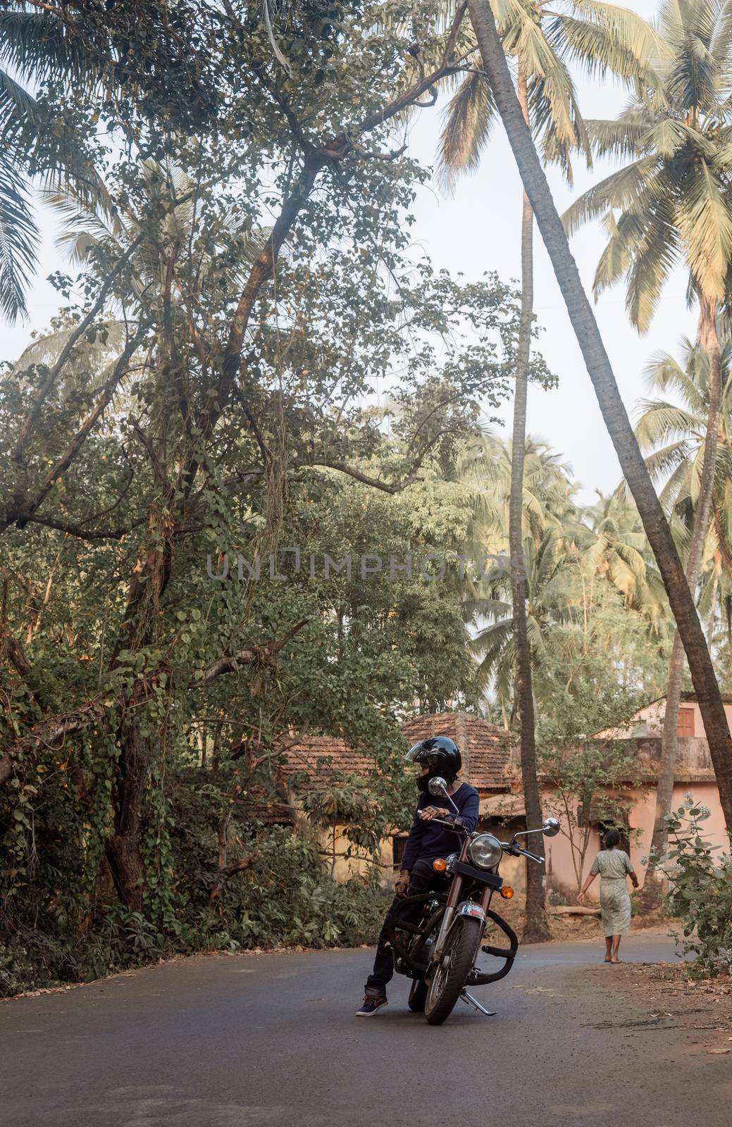 A Man On Motorcycle On Road in GOA village