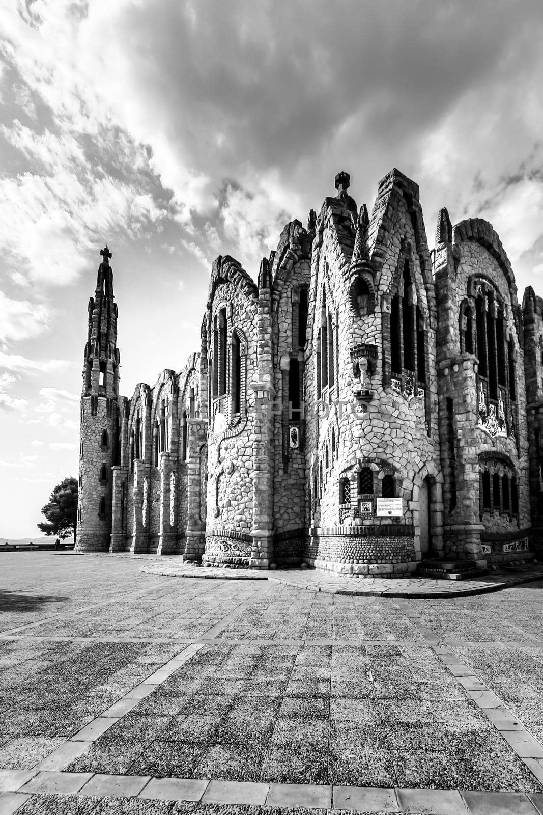 Novelda, Alicante, Spain- September 24, 2021: Details, archs, tower and pictures of Sanctuary of Santa Maria Magdalena on the top of the mountain in Novelda, Alicante, Spain.