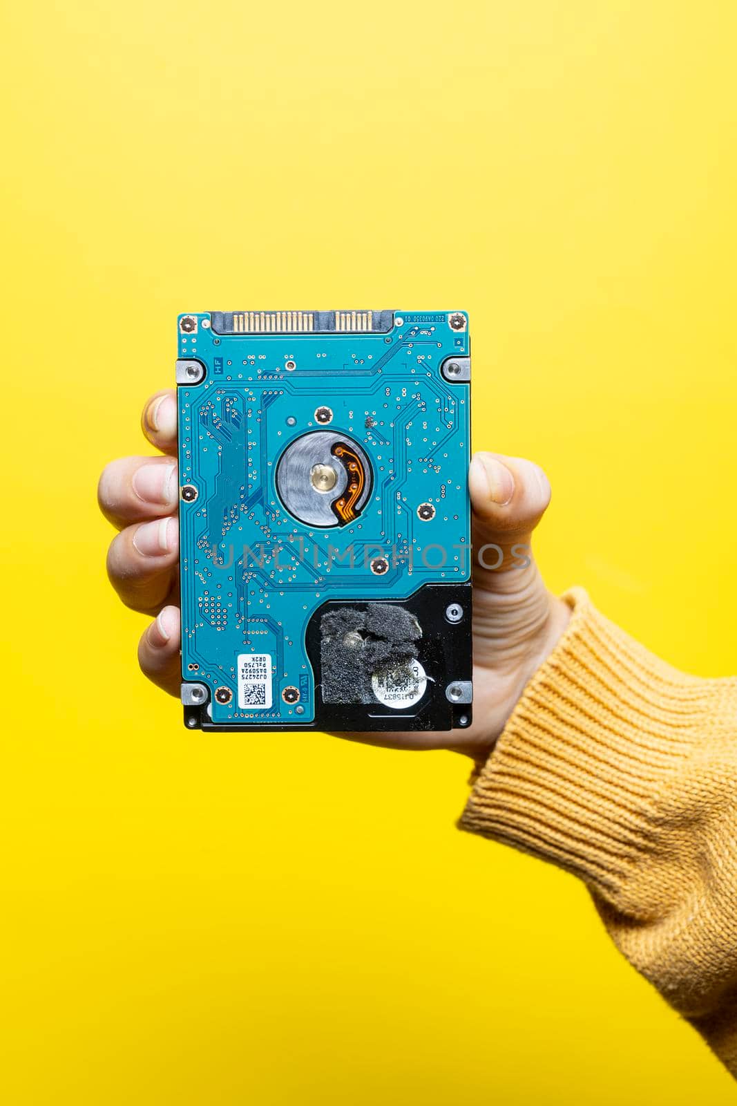 A 2.5-inch hard drive in a woman's hand