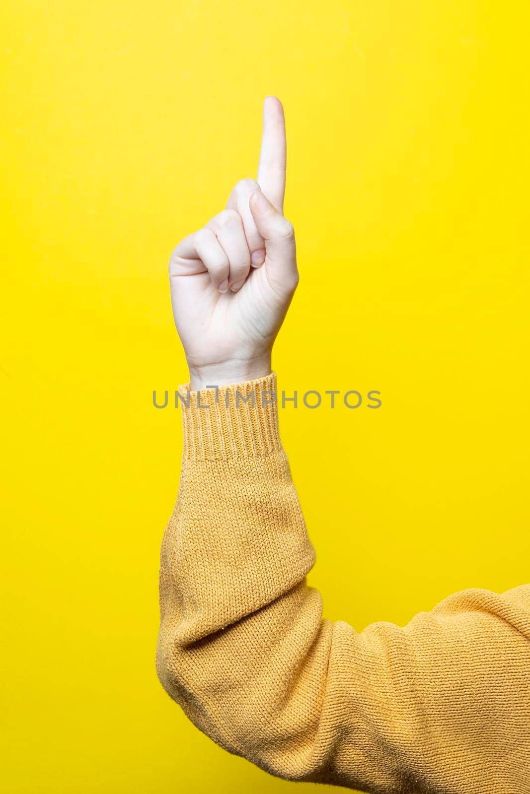 a woman's index finger pointing upwards