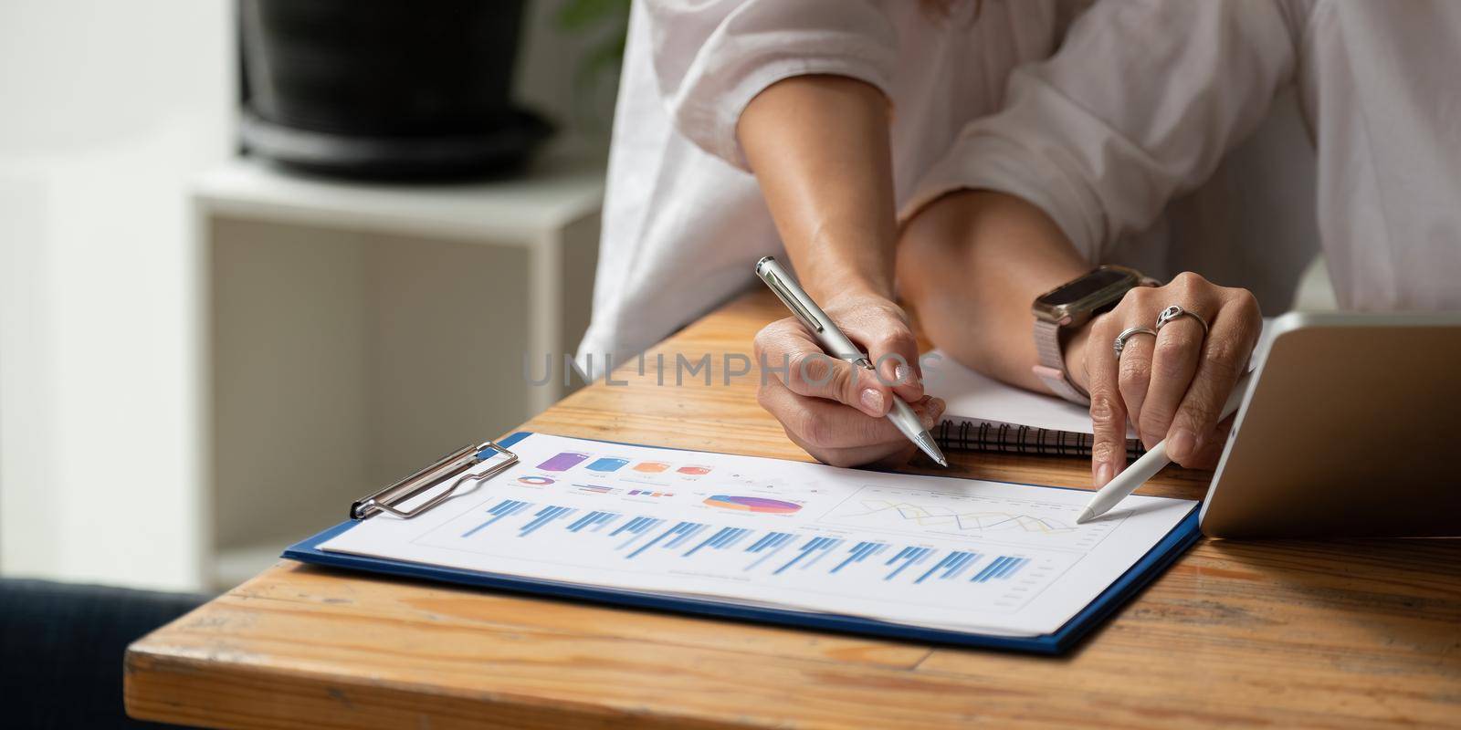 Close up business adviser meeting to analyze and discuss the situation on the financial report in the meeting room.Investment Consultant,Financial Consultant,Financial advisor and accounting concept