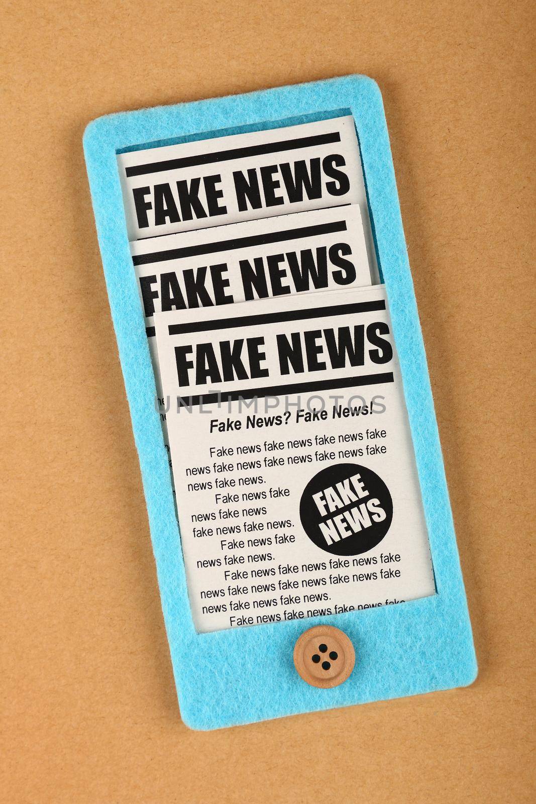 Felt craft smartphone with FAKE NEWS newspapers by BreakingTheWalls