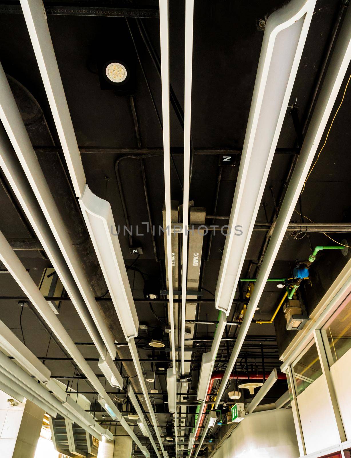 Ceiling mounted Lamps pipes and ducts of electric power and communication system by Satakorn