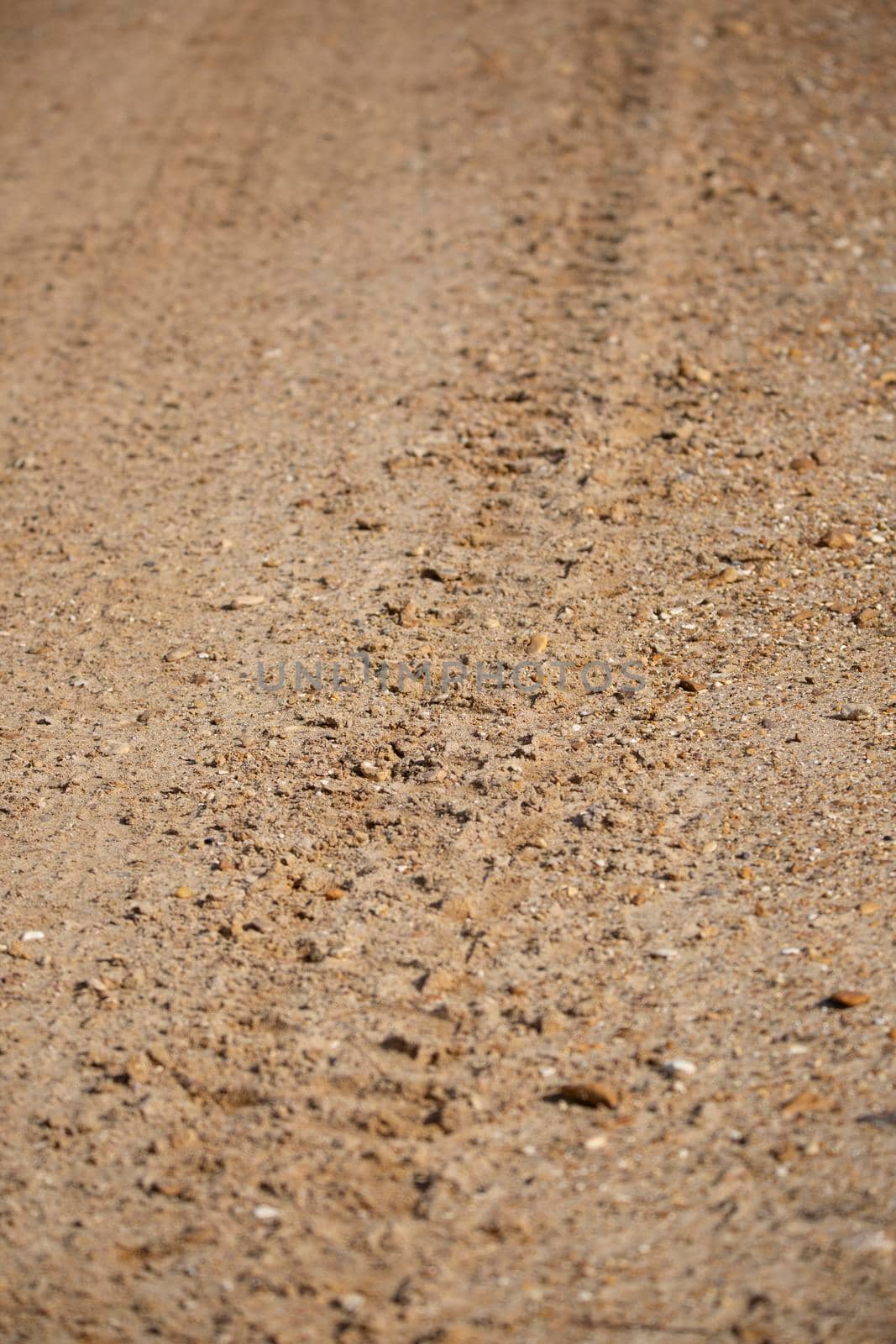 Tire Track on a Gravel Road by tornado98